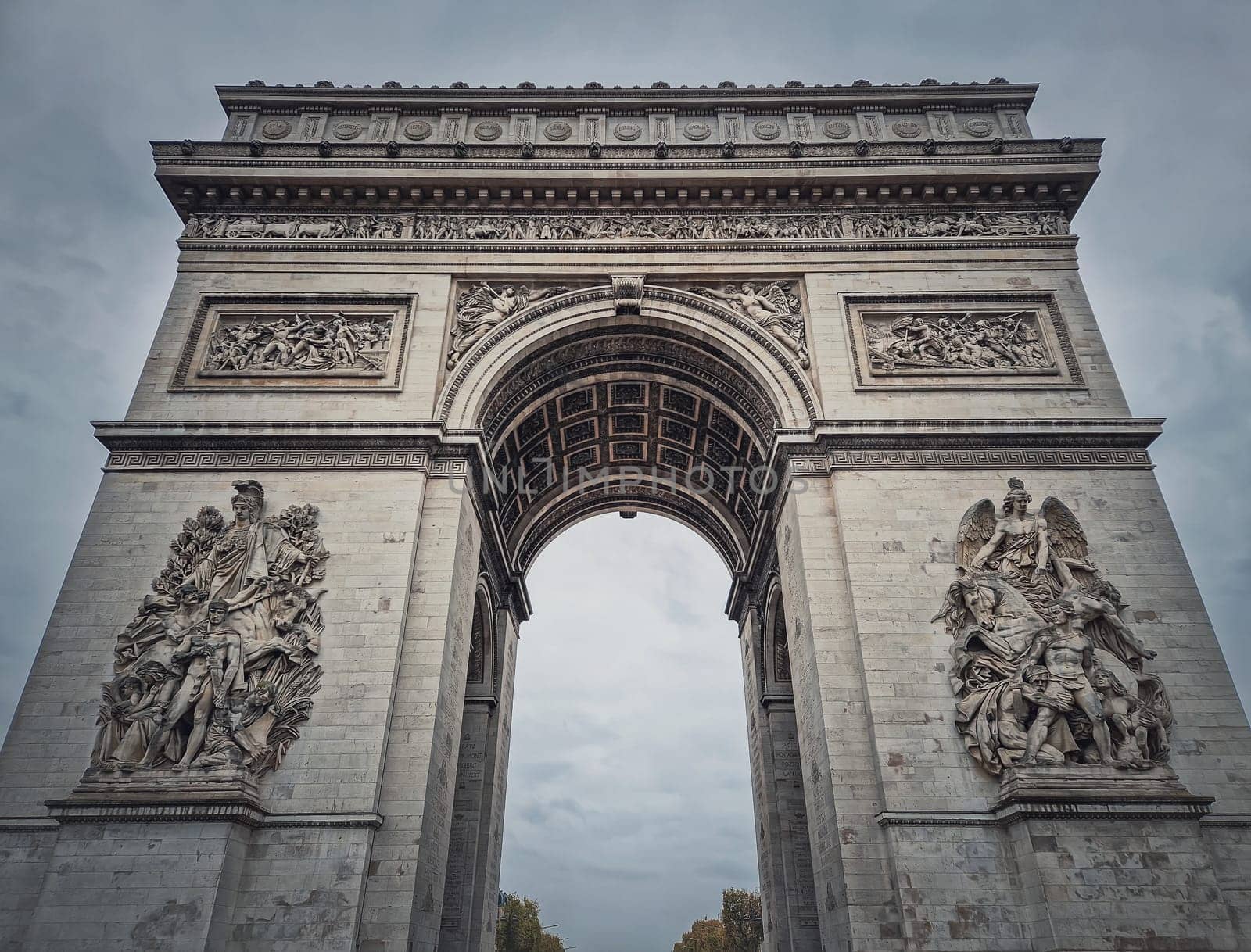 Triumphal Arch (Arc de triomphe) in Paris, France. Closeup architectural details of the famous historic landmark	
