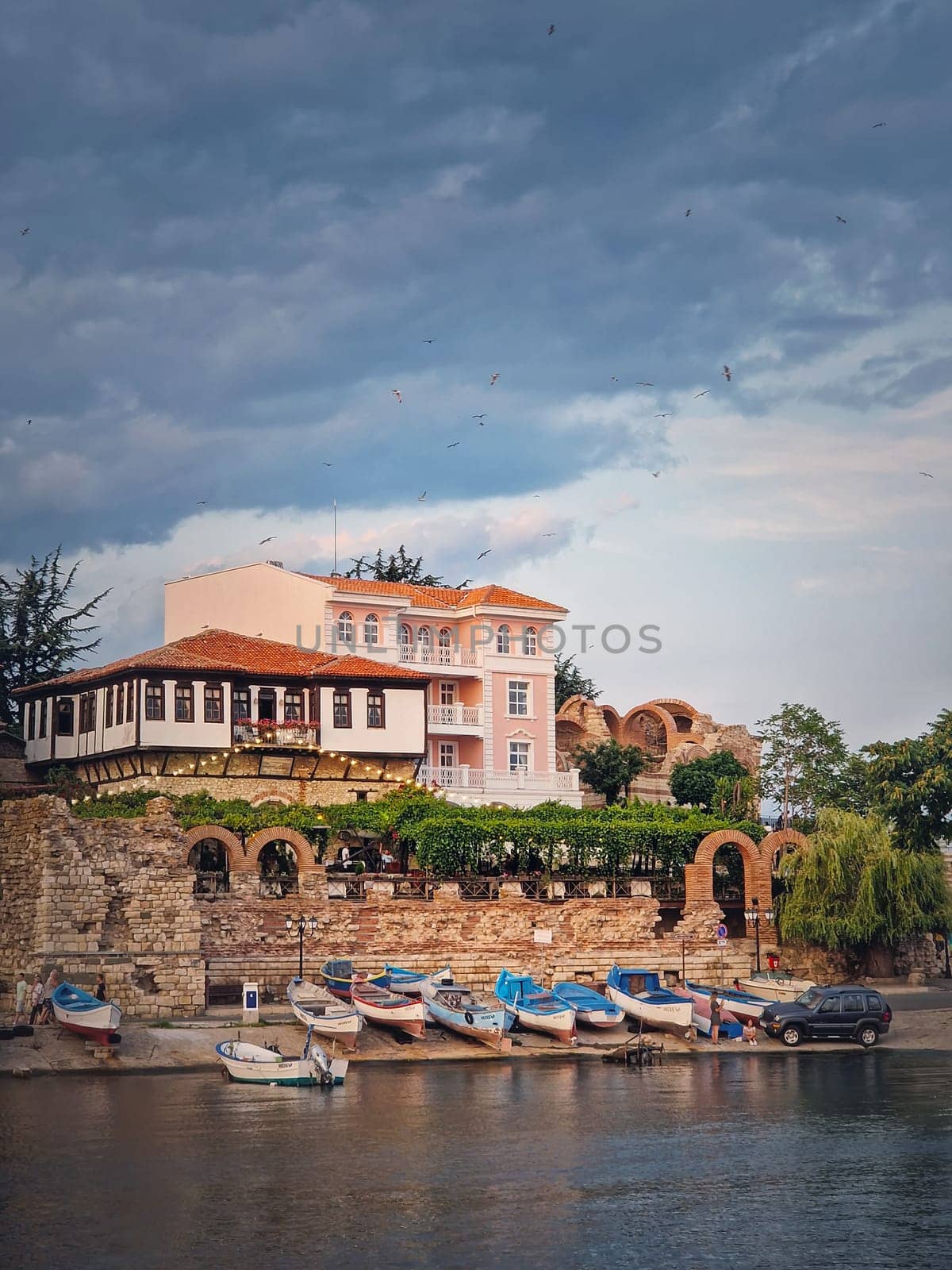 The old town of Nessebar, UNESCO world heritage on the Black Sea coastline, Burgas Region, Bulgaria. Sightseeing view with a mixture of ancient ruins and modern hotel resort on the coast by psychoshadow