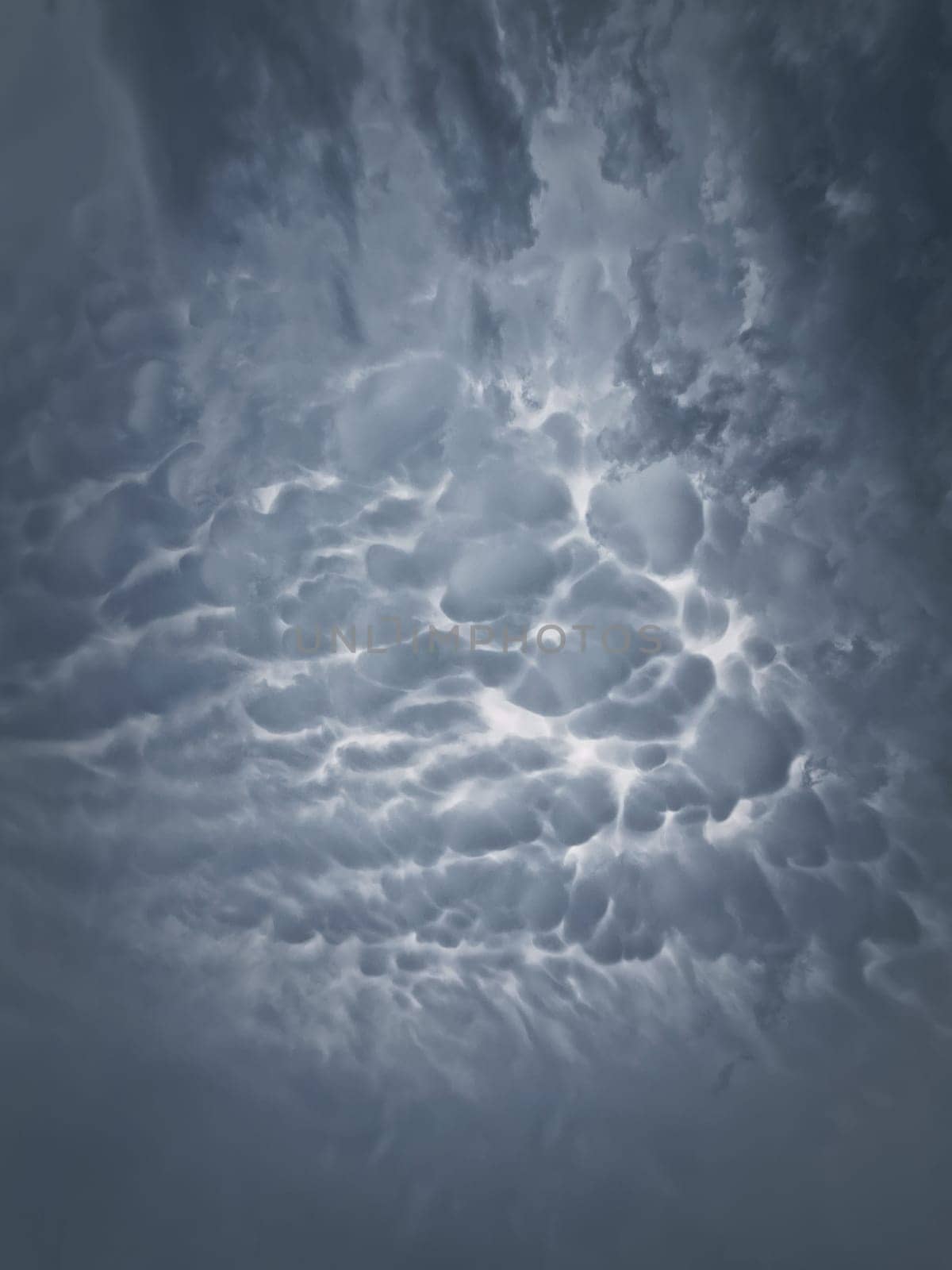 Mammatocumulus or Mammatus clouds formations. Abstract background of wonderful storm cloudscape. Dreamlike sky texture, celestial magic by psychoshadow