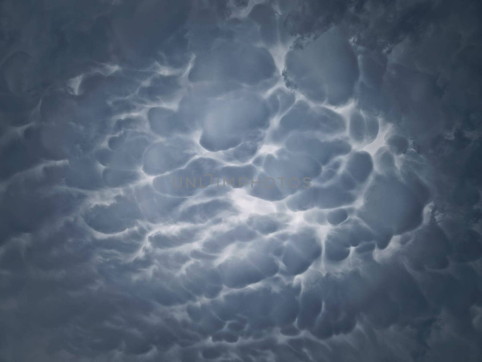 Mammatus cloud formations. Abstract background of wonderful storm cloudscape. Dreamlike sky texture, celestial magic by psychoshadow