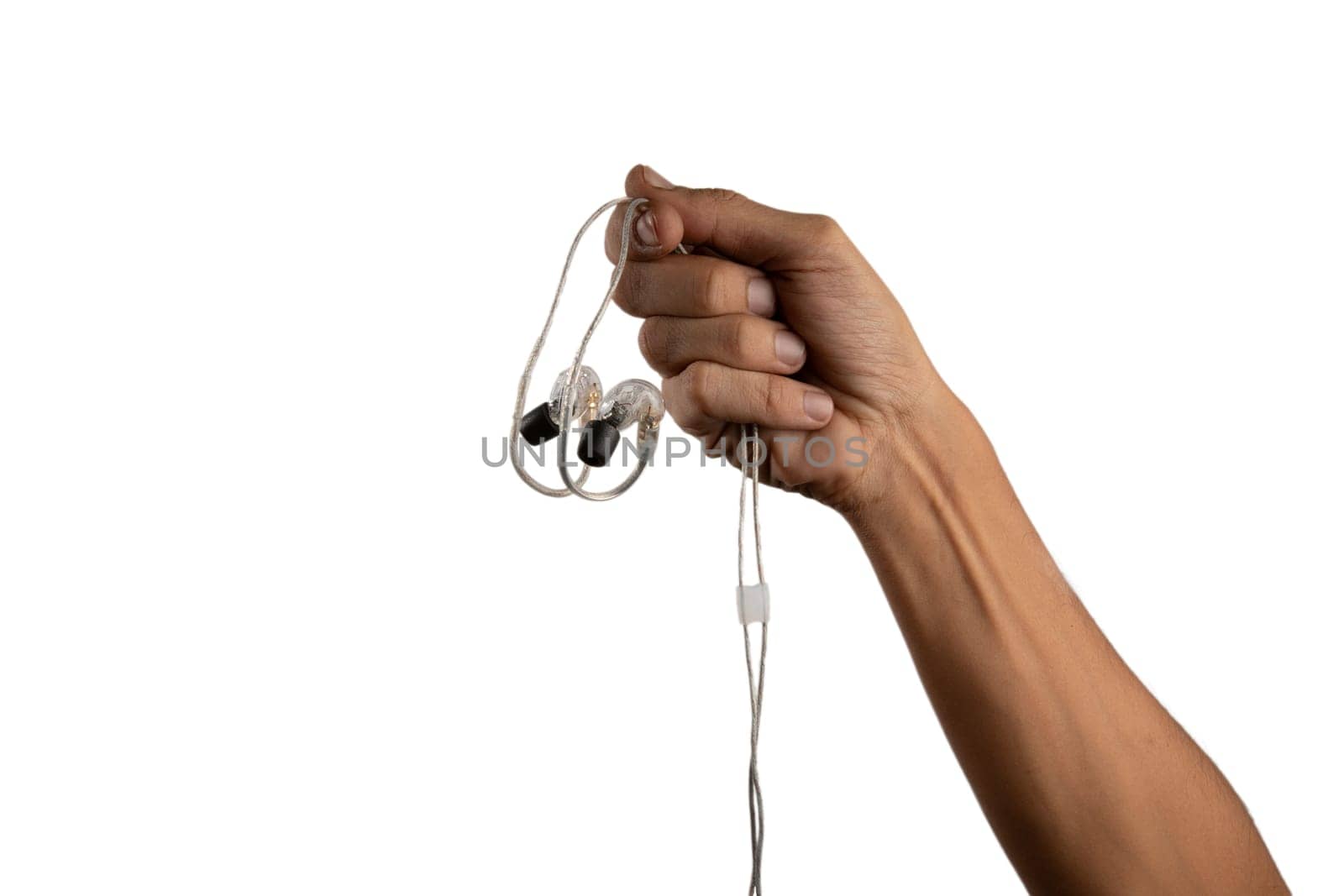 black male hand holding in ear headphone buds