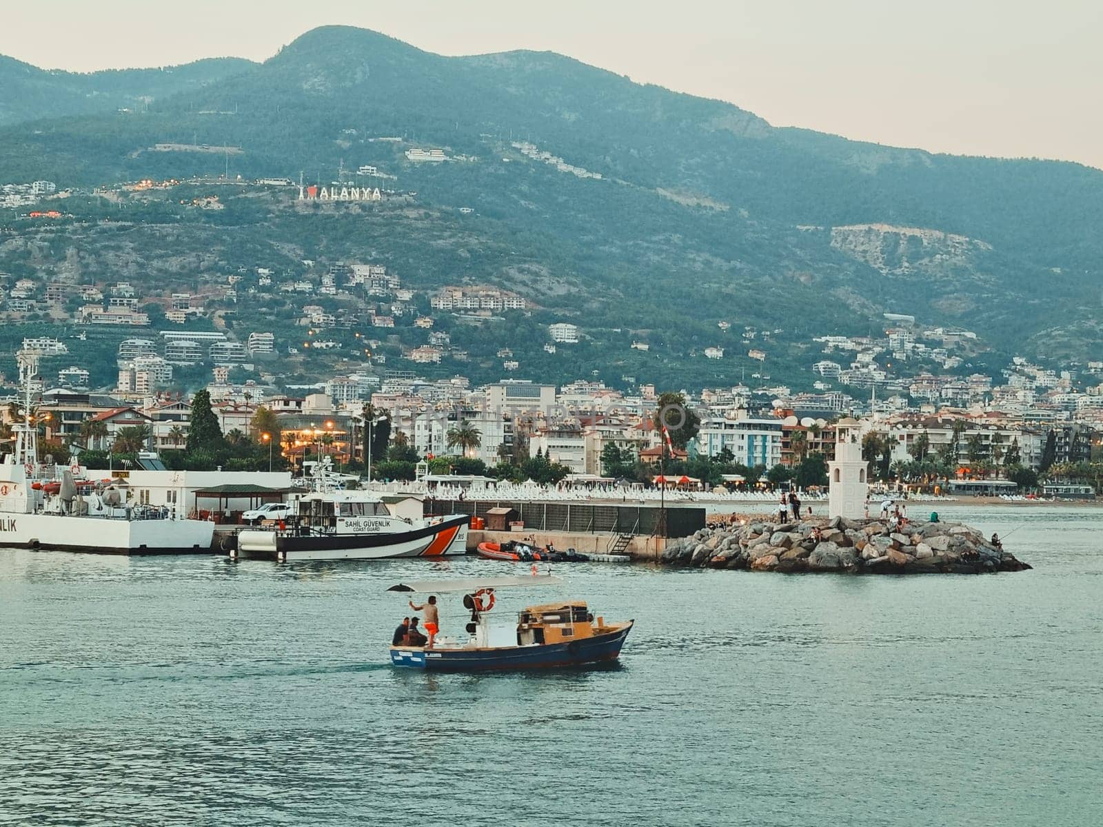 View of the city of Alanya from the sea, mountains, inscription I love Alanya, boats. Alanya, Turkey, August 5, 2022