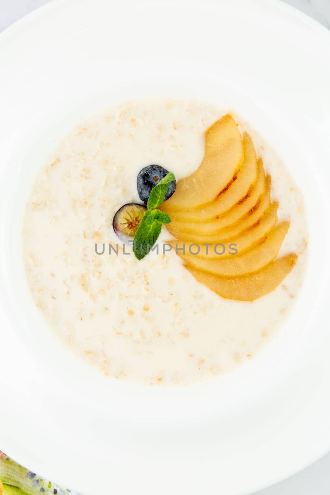 healthy breakfast with fruits in a white plate side view by tewolf