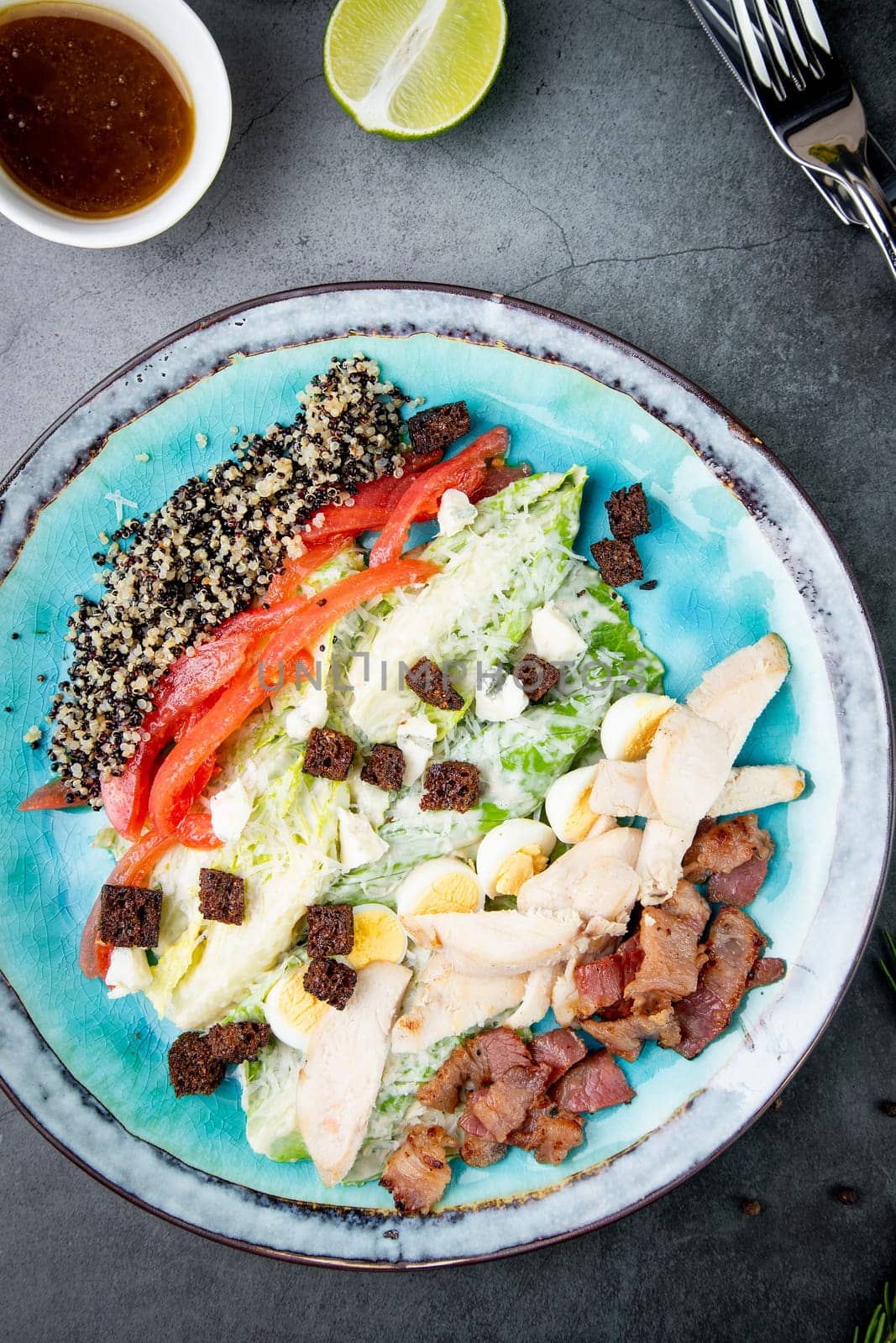 different types of meat, sesame seeds, greens and croutons