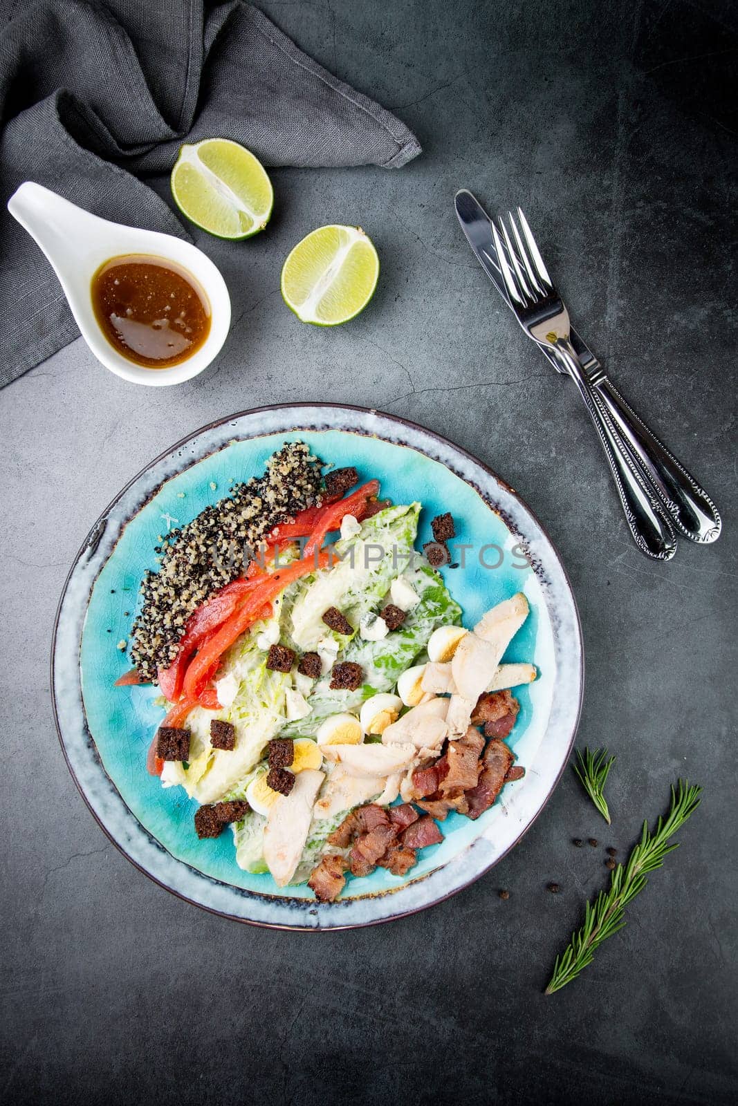 different types of meat, sesame seeds, greens and croutons