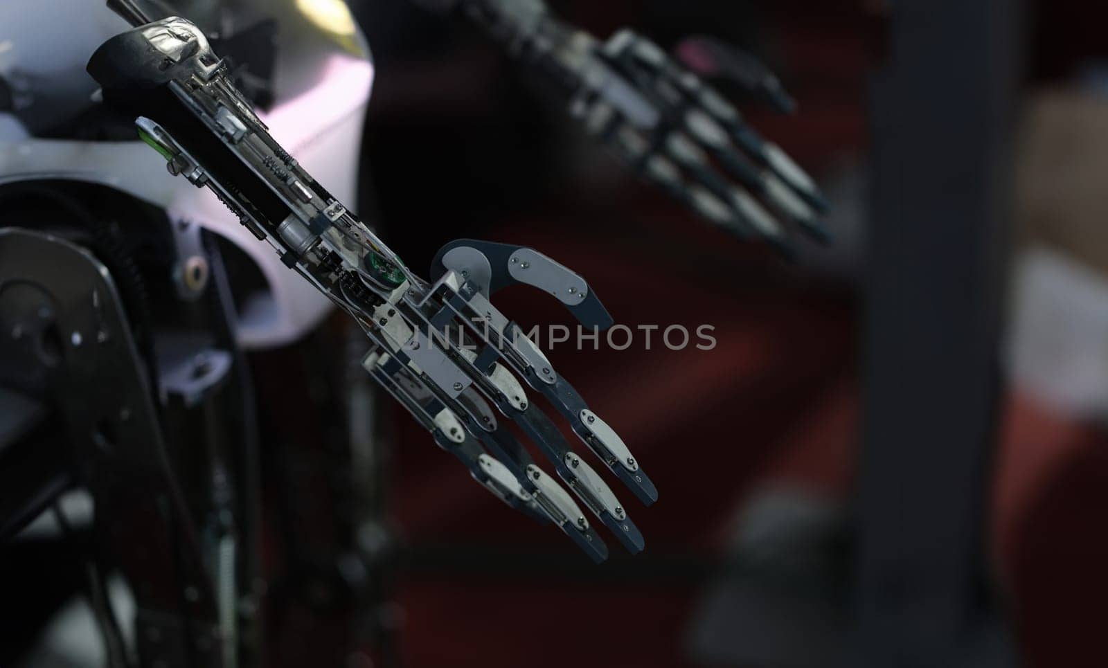 Dark metal robot arm. Creation of technologies and artificial intelligence.
