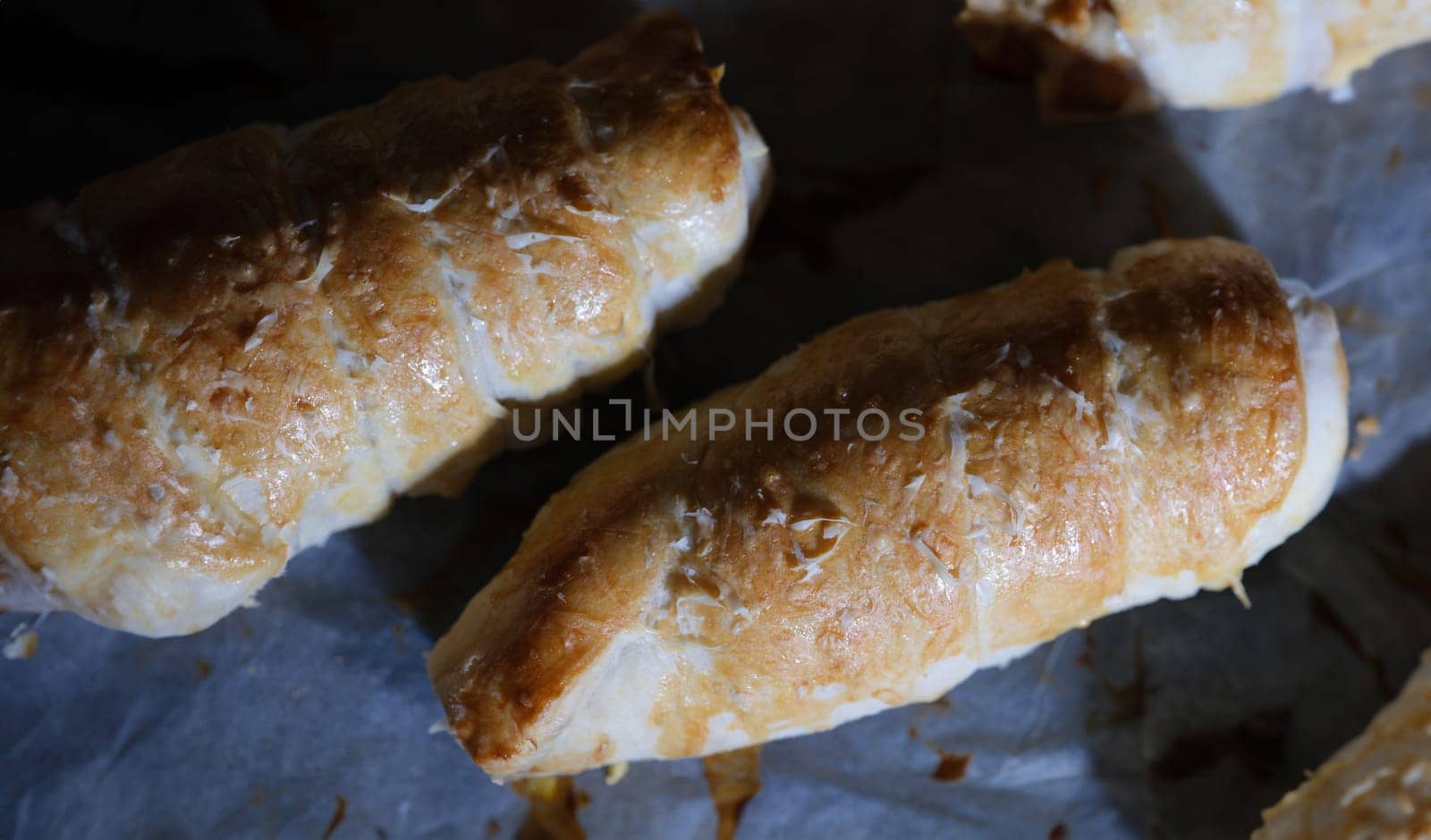 Freshly cooked sausage in dough in sauce. Cooking hot dogs at home concept