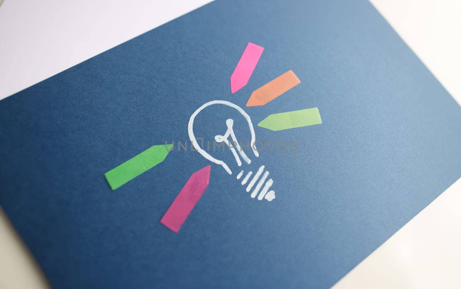 Drawn light bulb and colorful arrow stickers. New ideas and start successful business concept