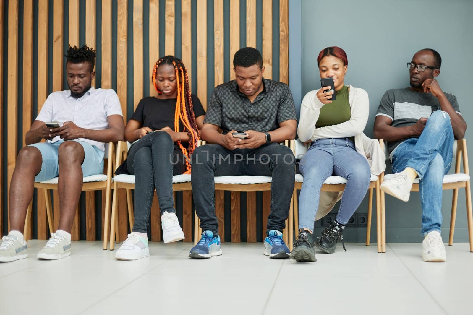 Group of people sleeping on a chair holding smartphones by Prosto