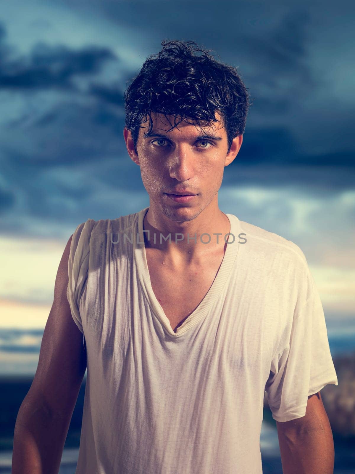 A Handsome Young Man Embracing the Cloudy Sky by artofphoto