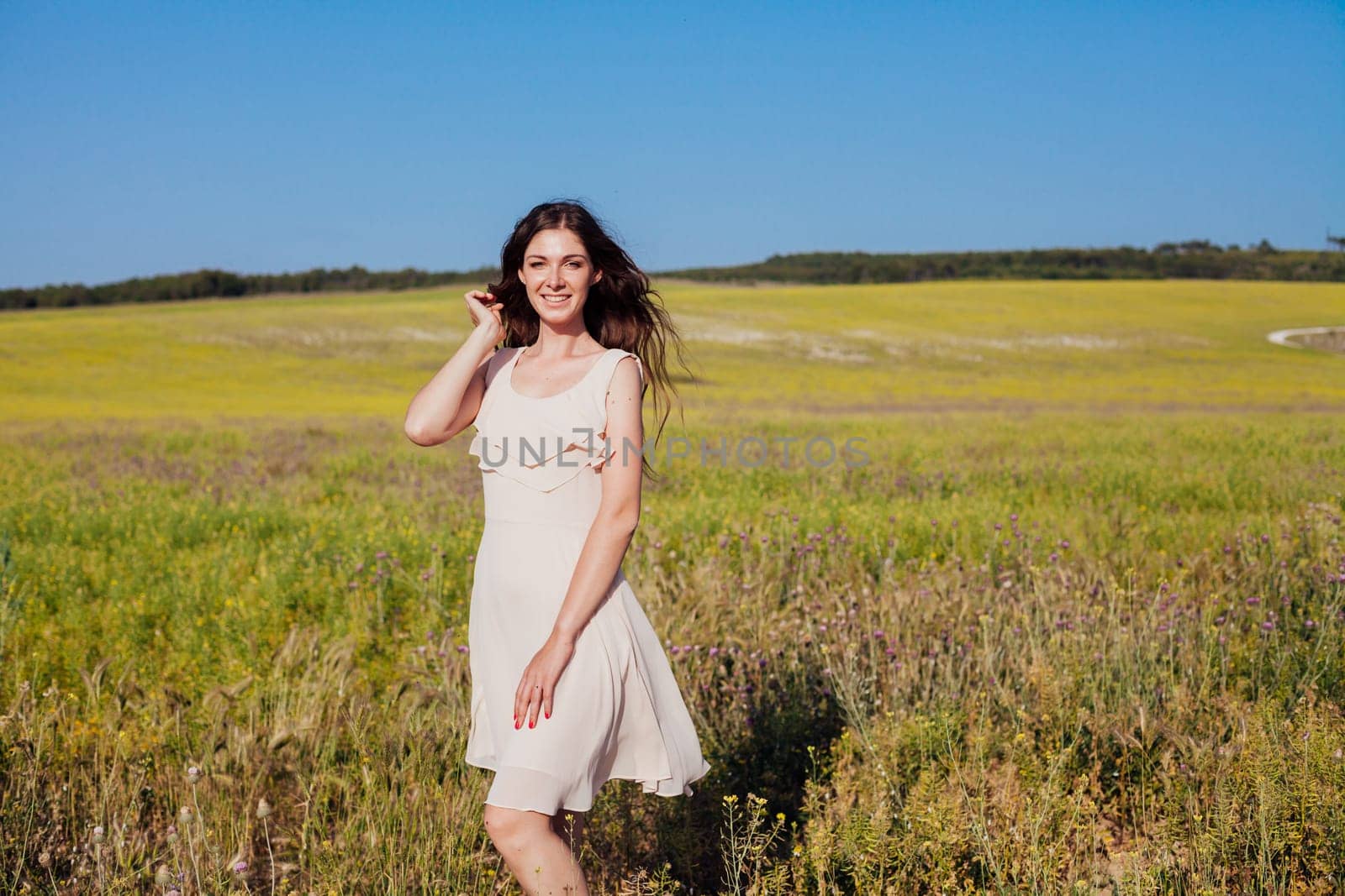 Portrait of a beautiful girl in a rural field