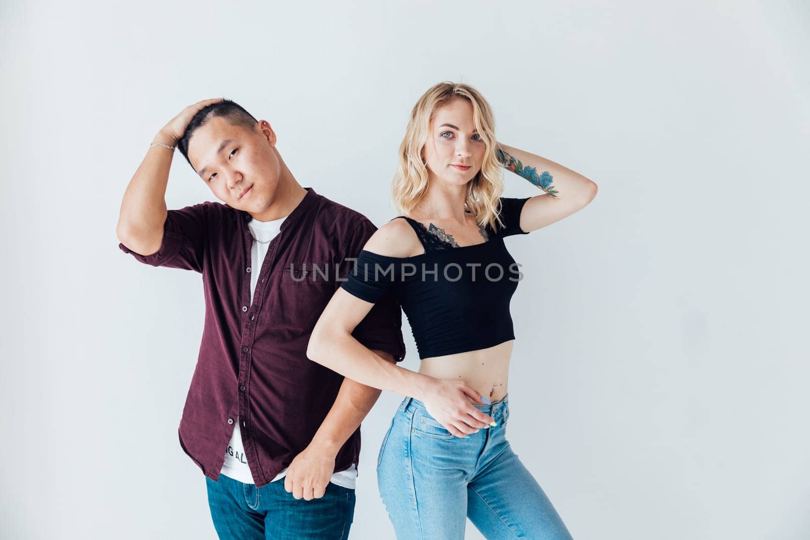 Man and woman lovers posing on white background by Simakov