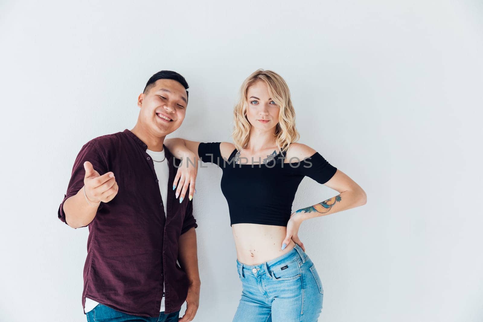 Man and woman posing on white background