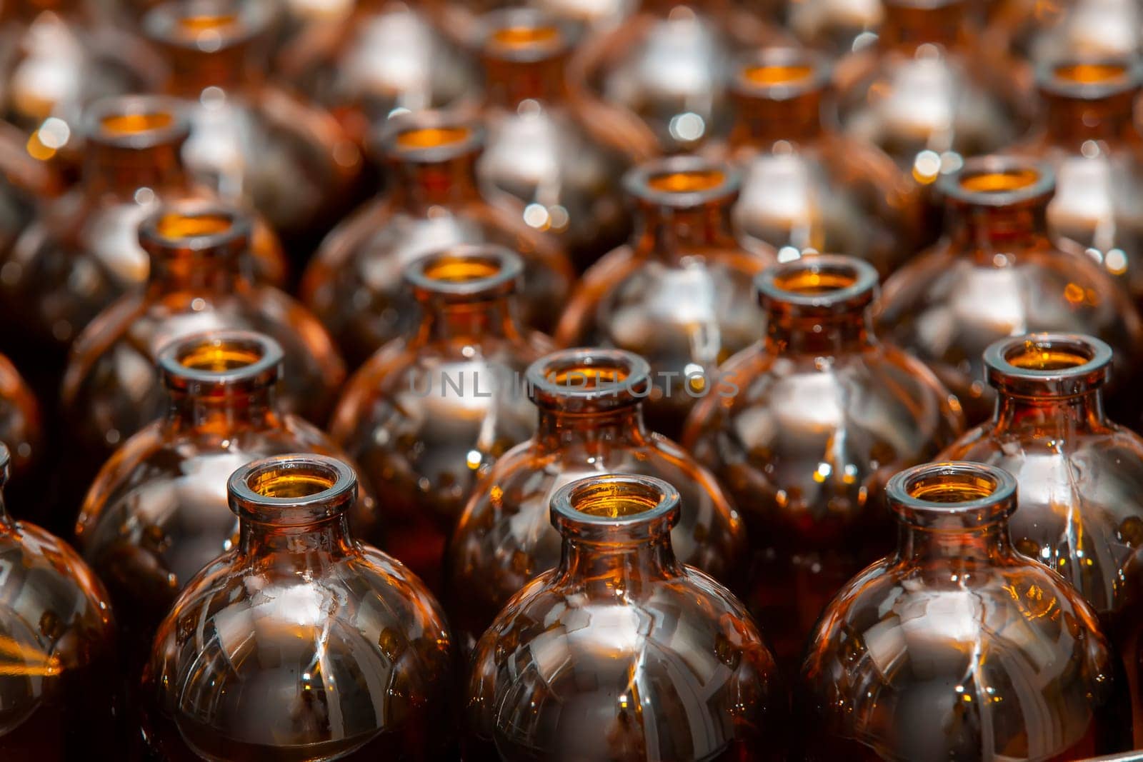Glass bottles in a factory for the production of medical and veterinary drugs. by Sviatlana