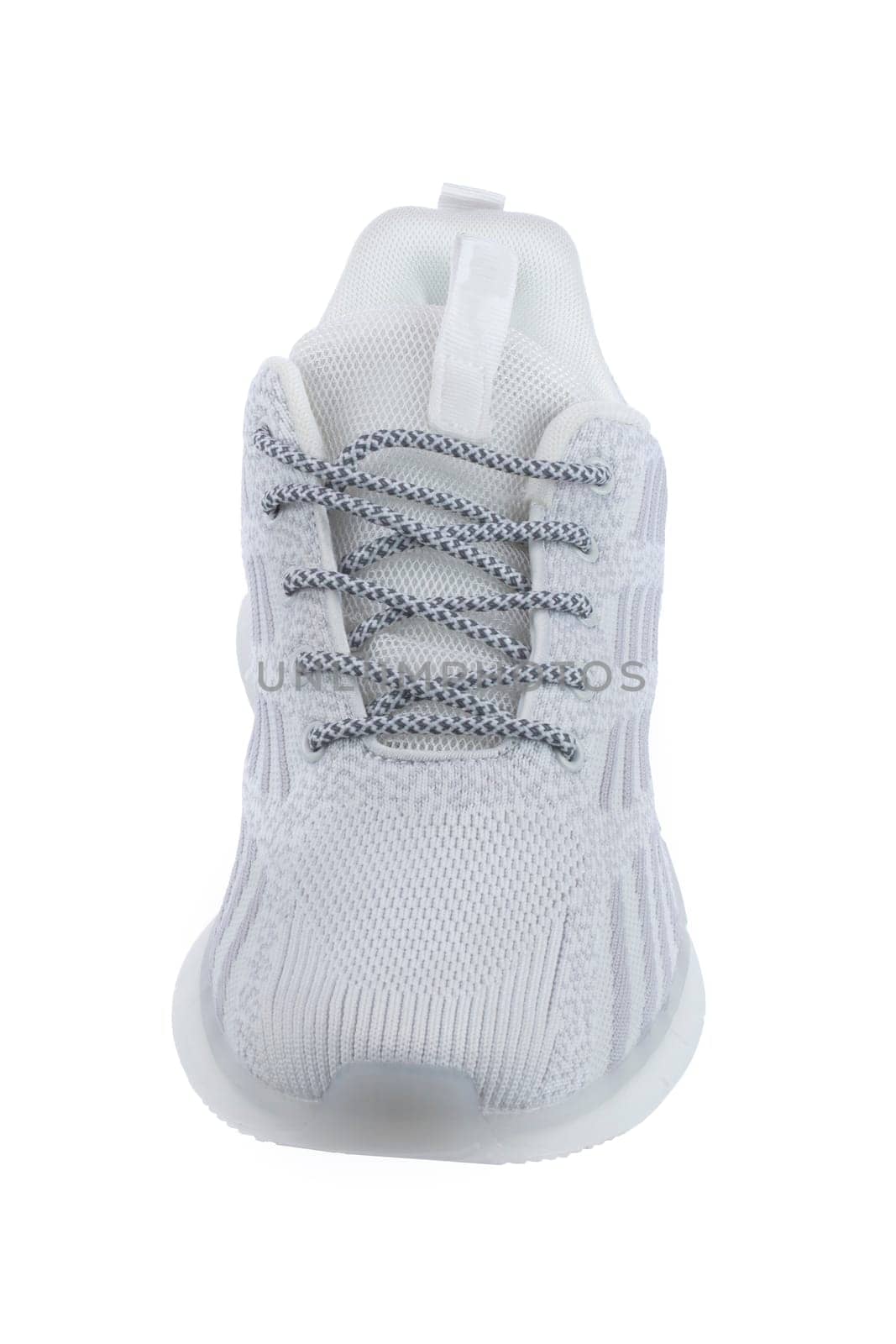 Sneaker one made of white fabric with lacing on a white background.