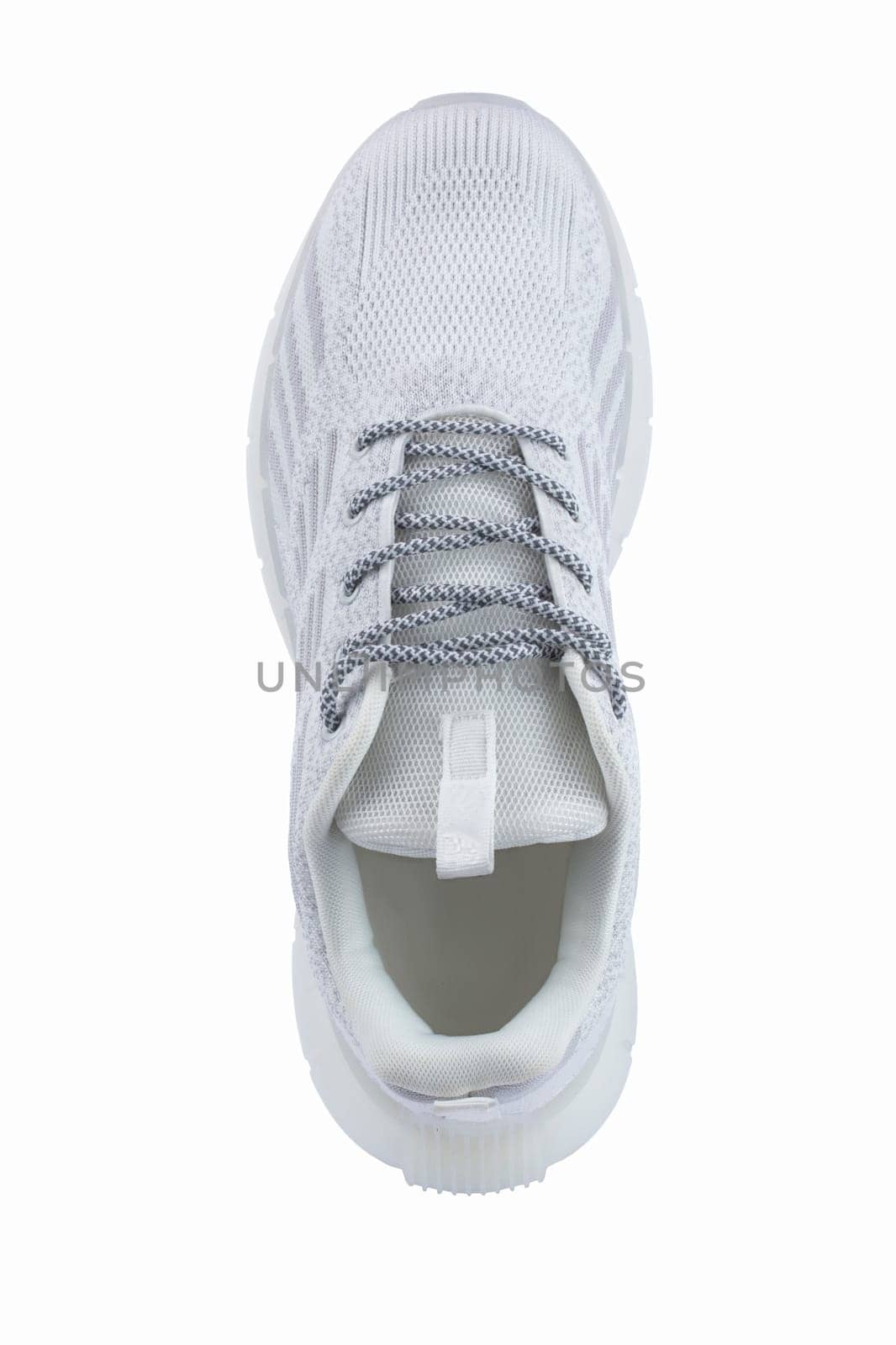 Sneaker one made of white fabric with lacing on a white background. by Sviatlana