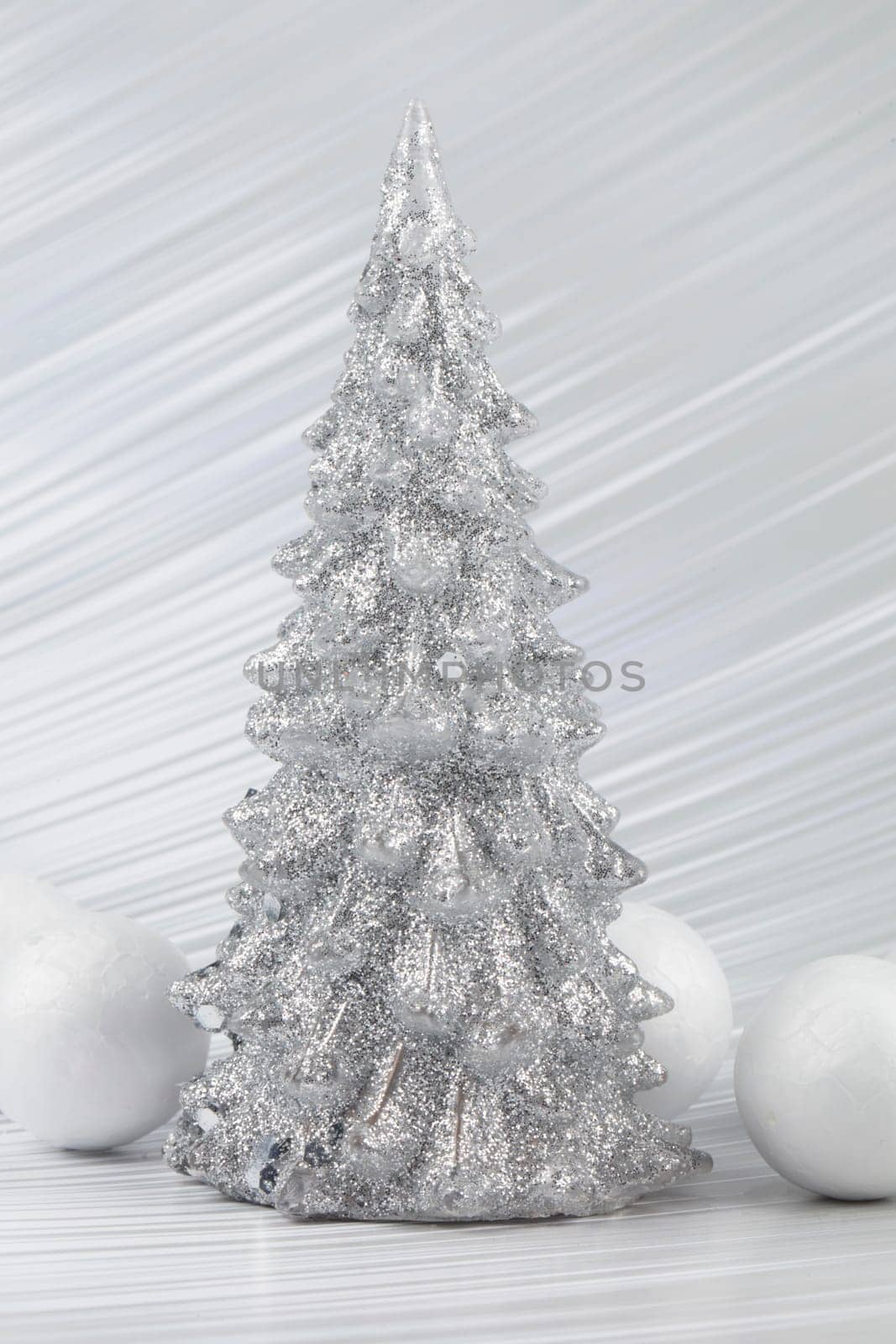Christmas or New Year background with silver snowy tree and white transitional decoration. Bright festive background. by Sviatlana
