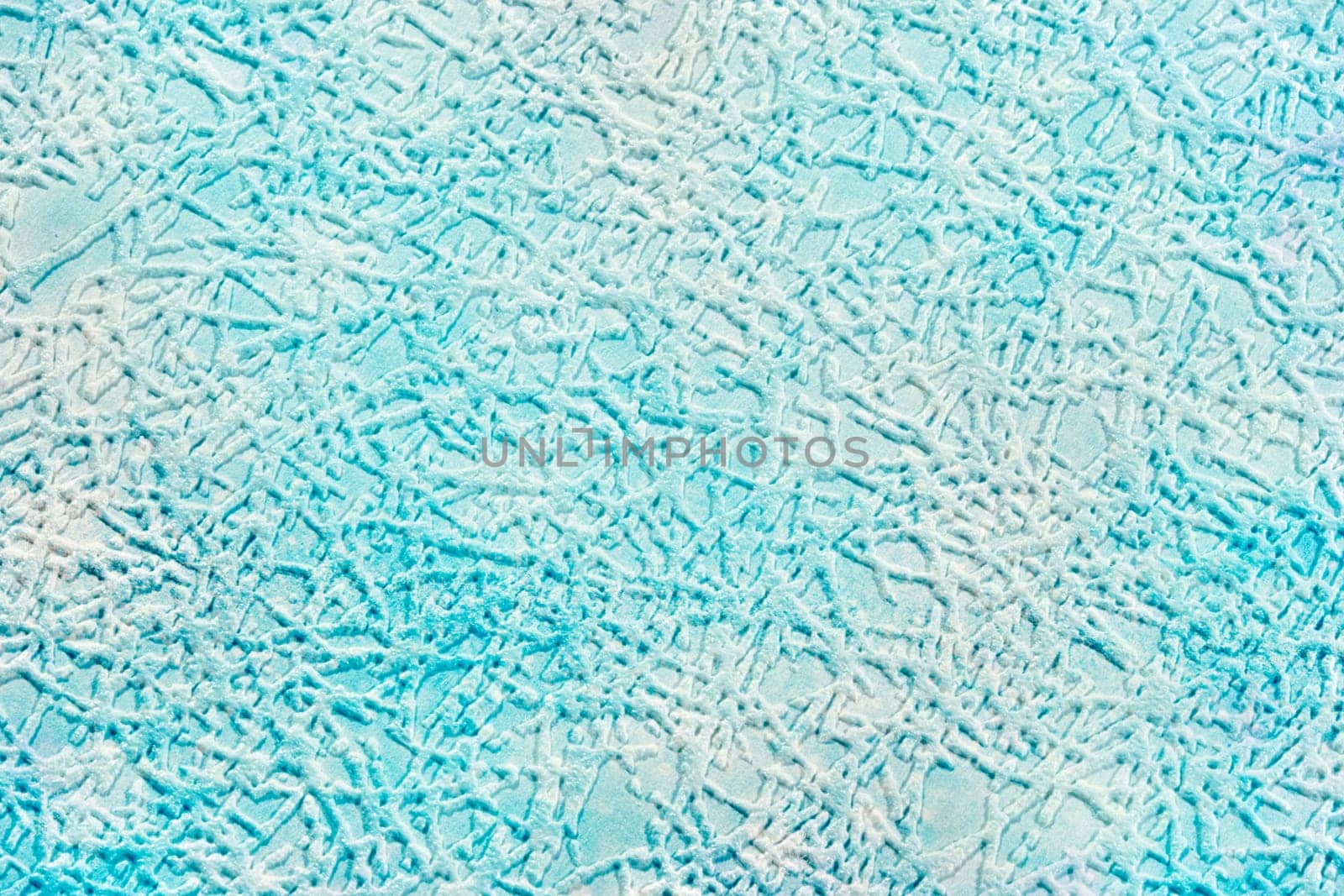On a pale blue paper background, textured strokes imitating hoarfrost or a pattern of hoarfrost on glass. by Sviatlana