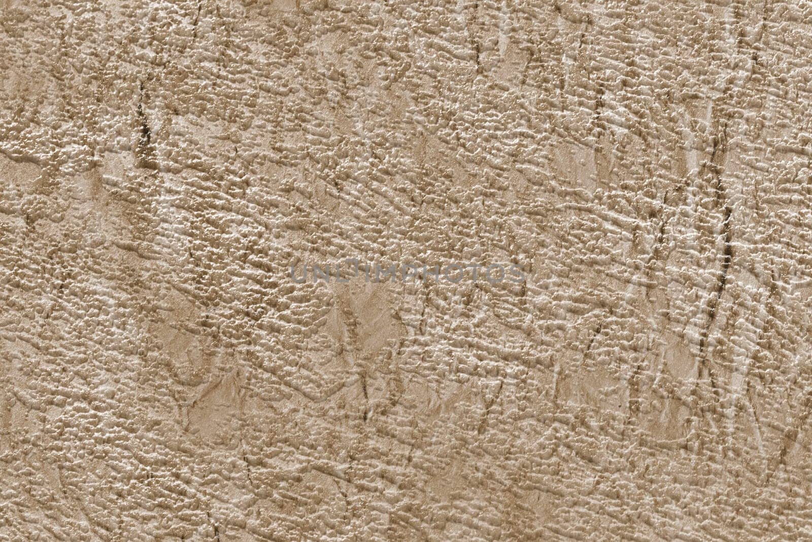 Paper textured background in beige color with scuffs and scratches. Expensive Venetian plaster.