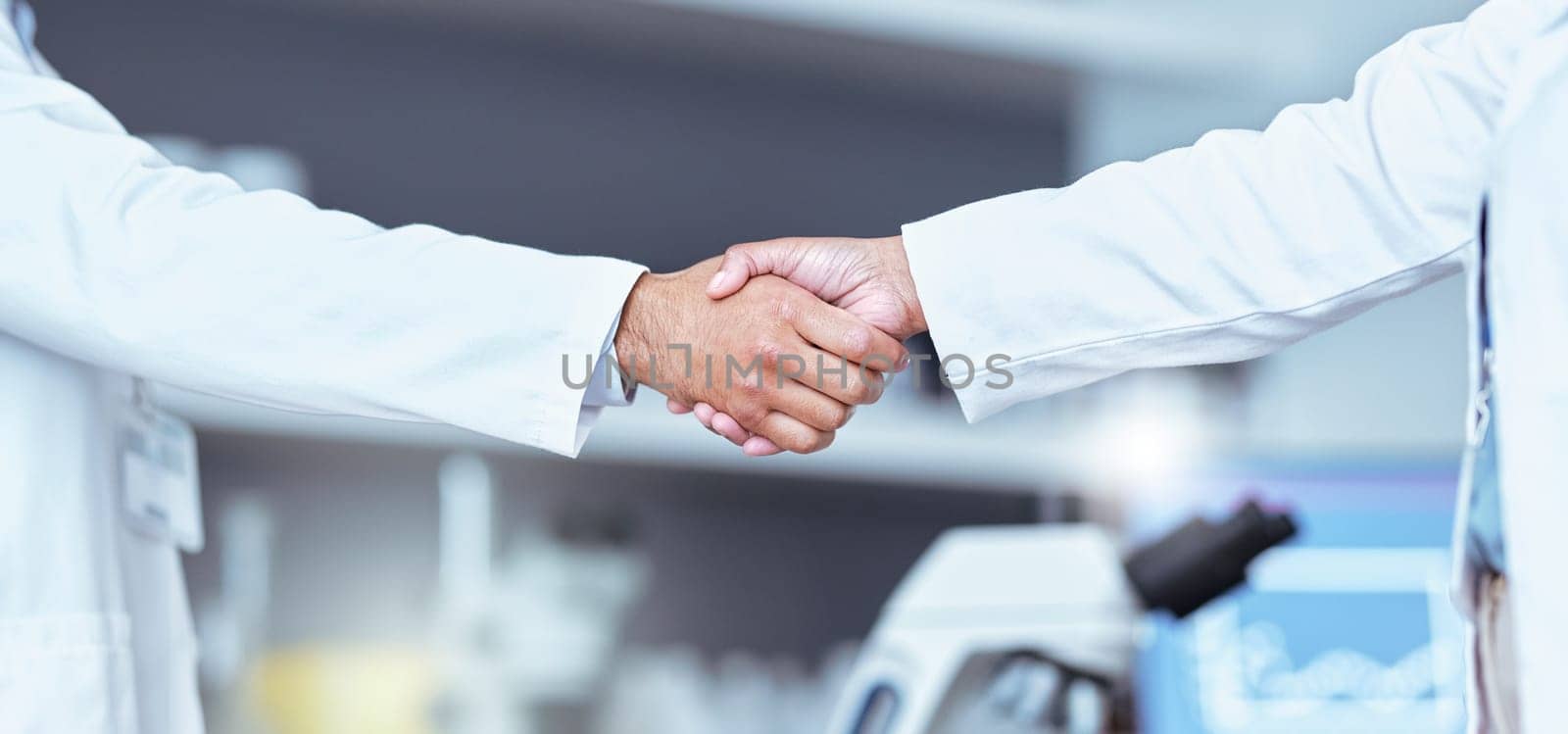 Hand shake, partnership and lab scientist, people or team work, collaboration and cooperation on medical science. Doctors, teamwork and closeup partner handshake for unity, agreement or staff welcome by YuriArcurs