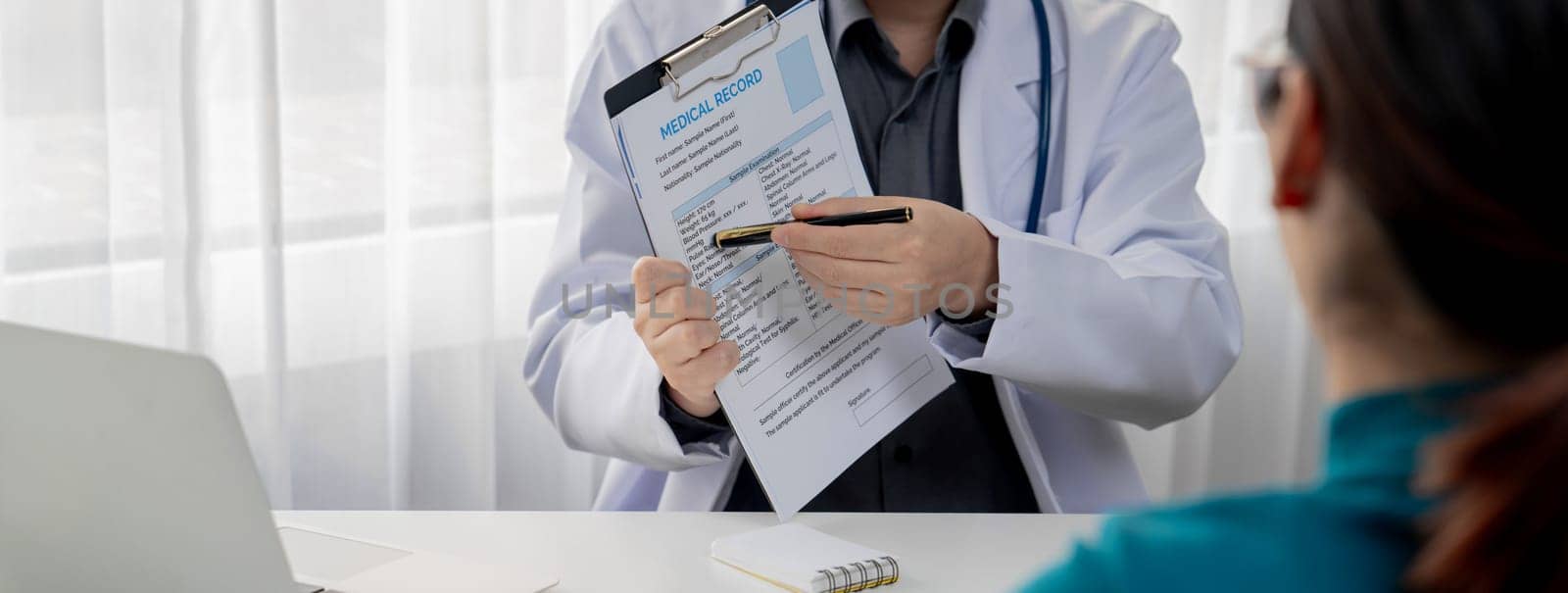 Patient attend doctor's appointment at clinic or hospital office, discussing medical treatment options and explaining examination results or medical record about sickness. Panorama Rigid