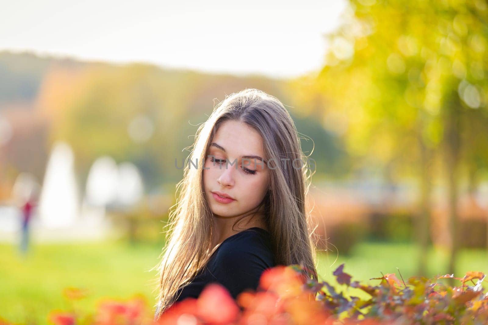 Portrait of a beautiful girl in an autumn park