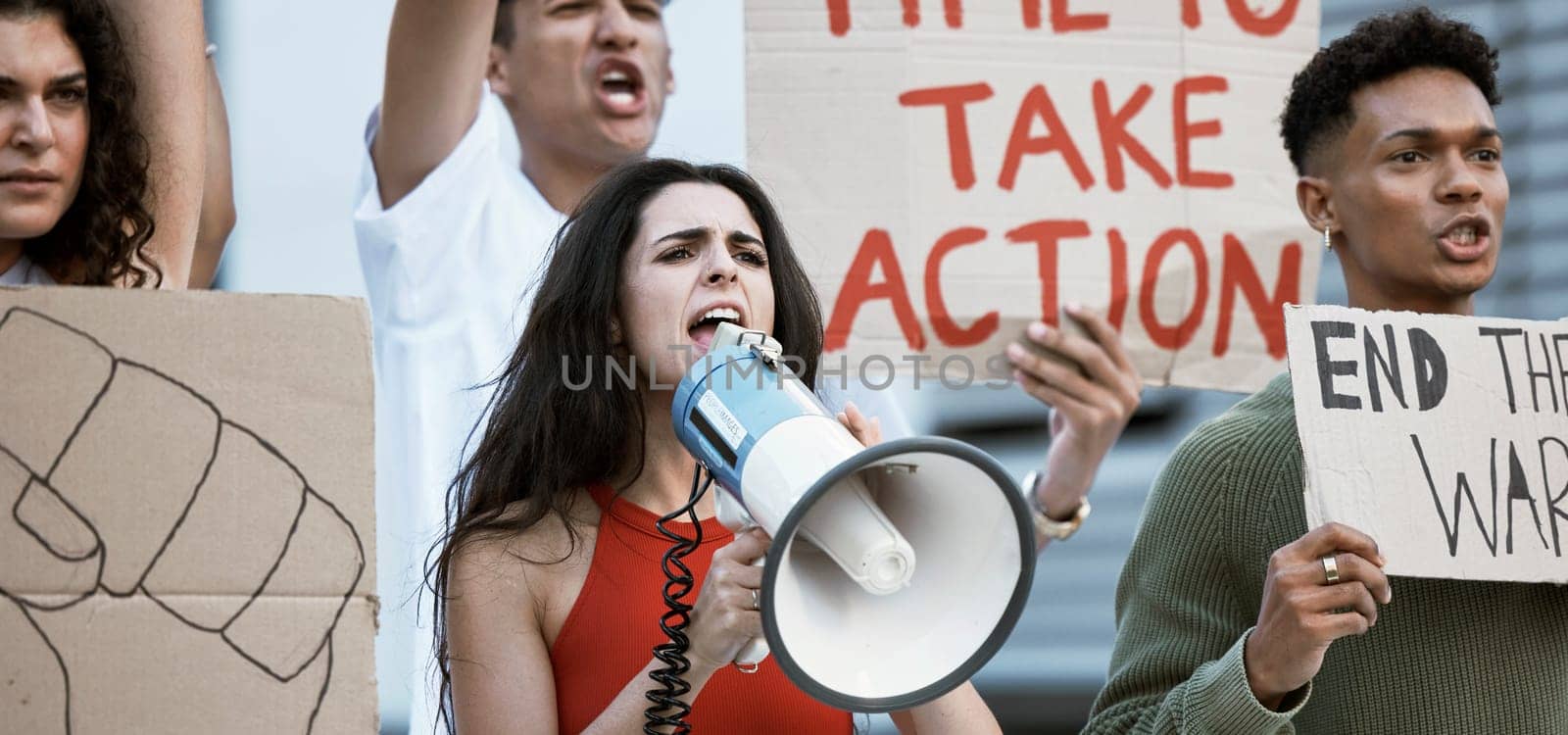 Community, justice and woman with a megaphone for protest announcement, change or power. Speaker, transformation and crowd of people with bullhorn for rally, vote or freedom, government or speech by YuriArcurs