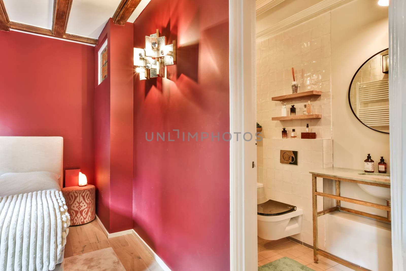 a bedroom and a bathroom with red walls and white by casamedia