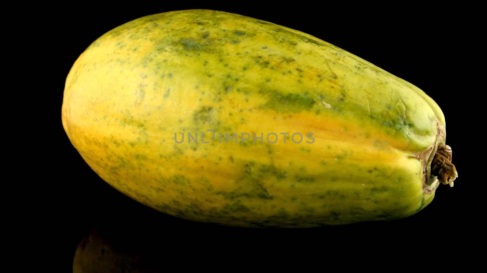 Papaya fruit on black background by homydesign