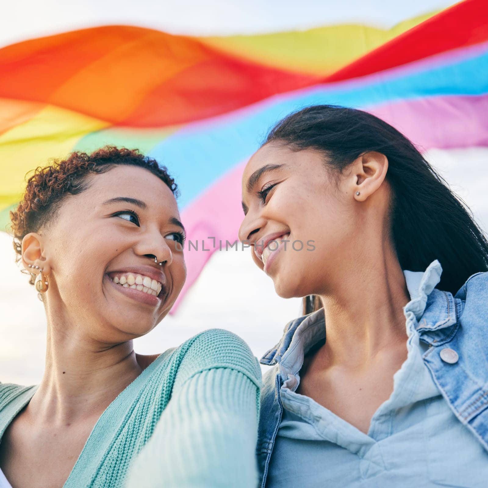 Happy, couple and lesbian with women in selfie, pride flag and lgbt relationship with love and happiness. Female people smile in picture, gen z youth and gay equality, support and trust with partner.