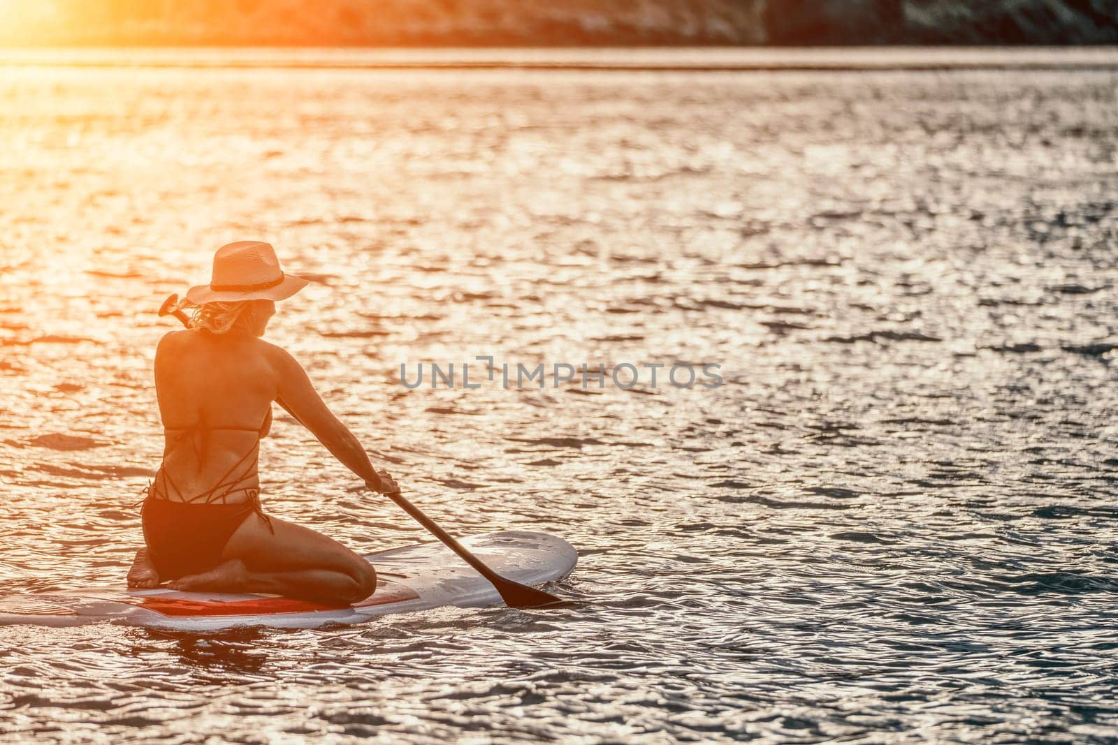 young woman in stylish bikini lying on seashore, closeup. Holiday, vacation and recreational concept.