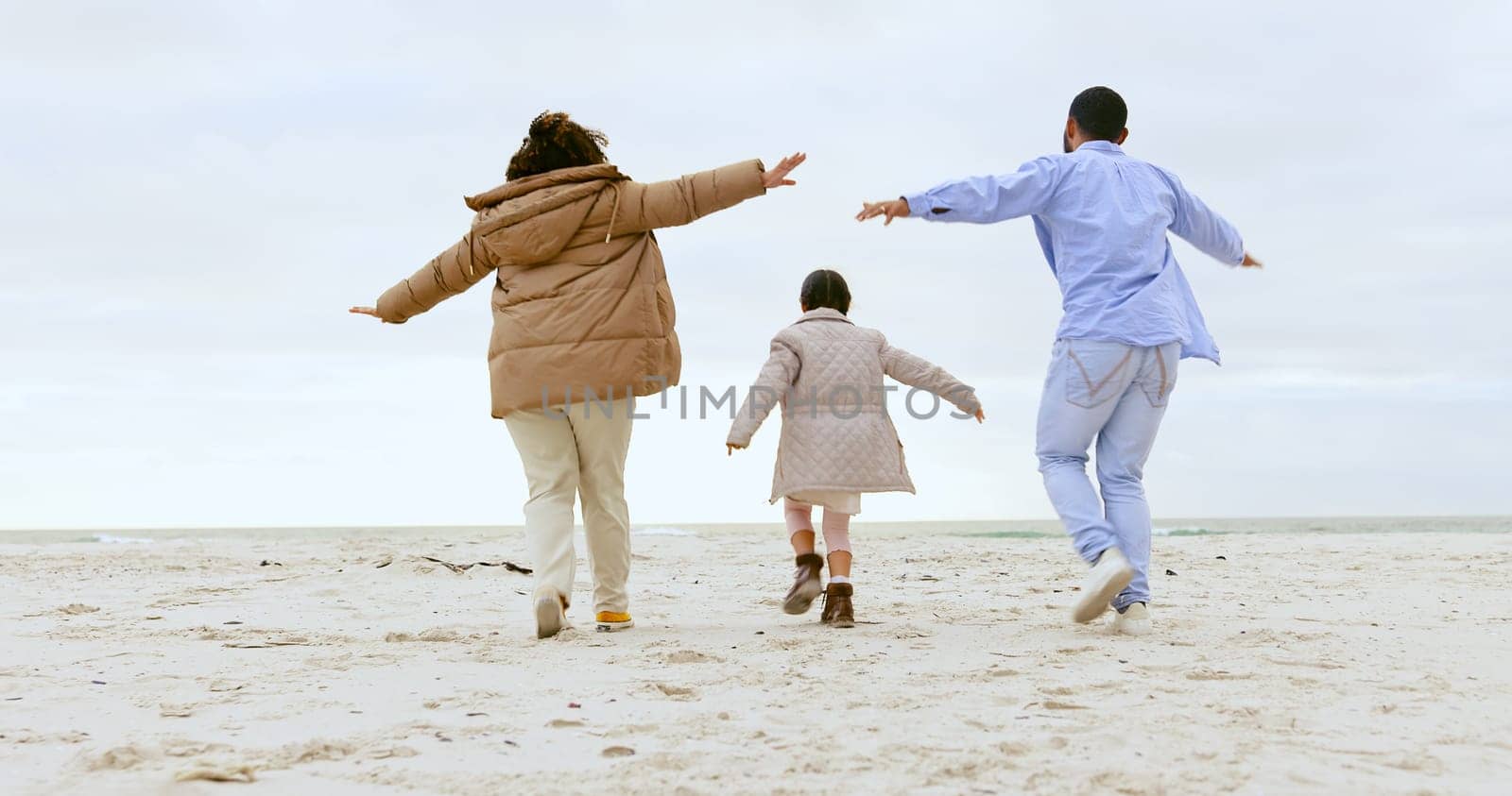 Happy family, airplane game and beach in nature or support love, relax and calm holiday. Young man, woman and child with playing for care, marriage and vacation in rio de janeiro for health wellness.