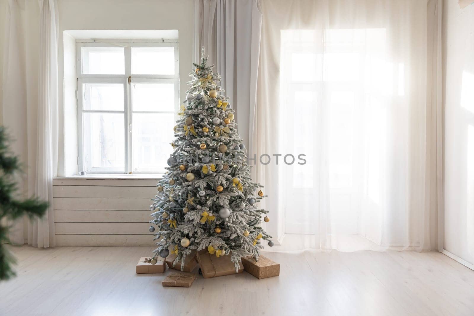 Interior christmas tree with gifts decorations for new year by Simakov