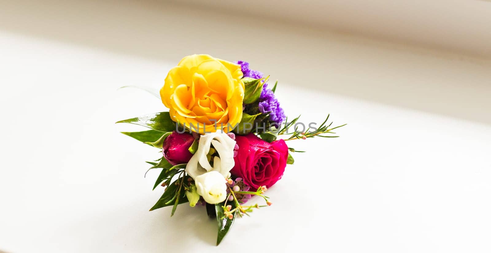 Gentle groom's boutonniere. Wedding accessories for a groom