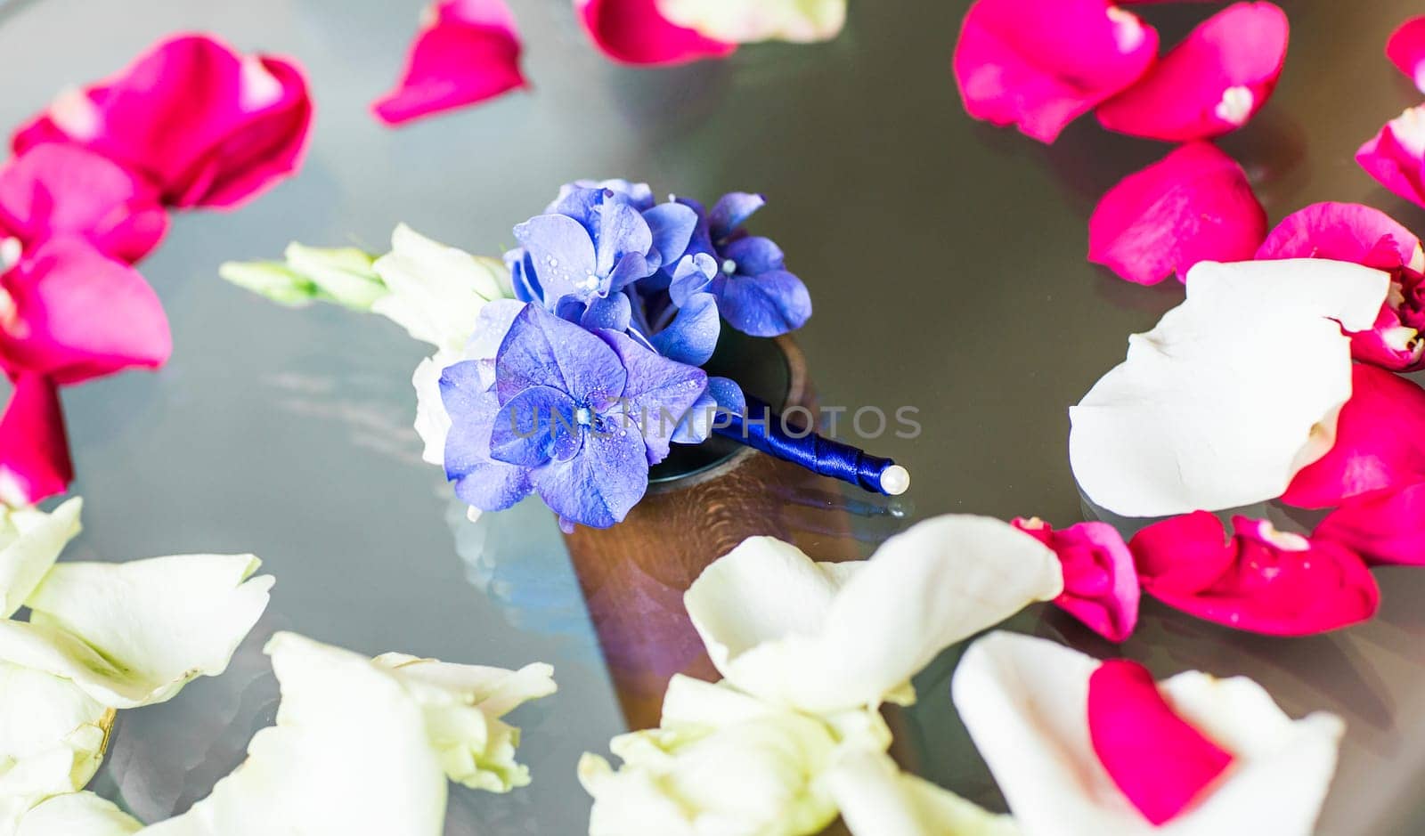 Gentle groom's boutonniere. Wedding accessories for a groom