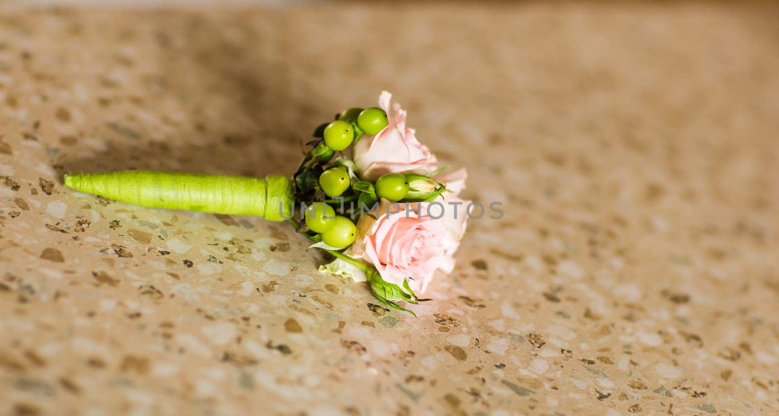 Gentle groom's boutonniere. Wedding accessories for a groom