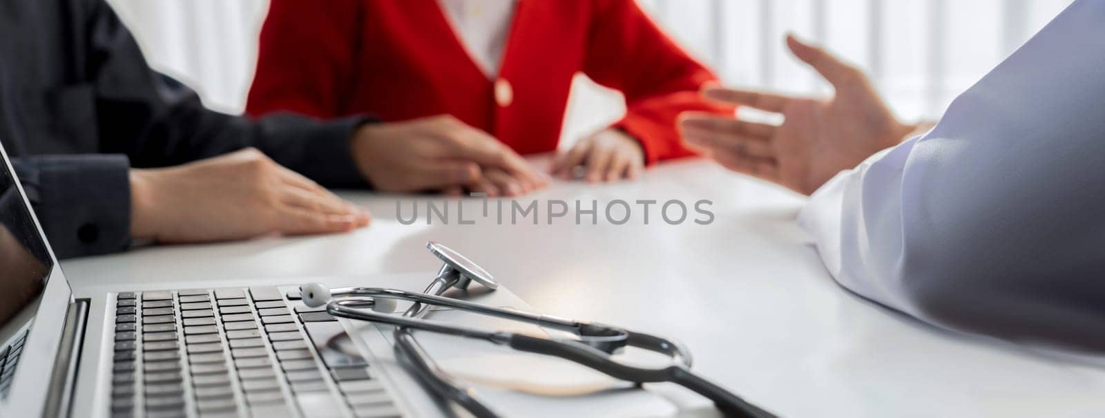 Couple attend fertility or medical consultation with gynecologist at hospital as family planning care for pregnancy. Husband and wife consoling each other through doctor appointment. Panorama Rigid