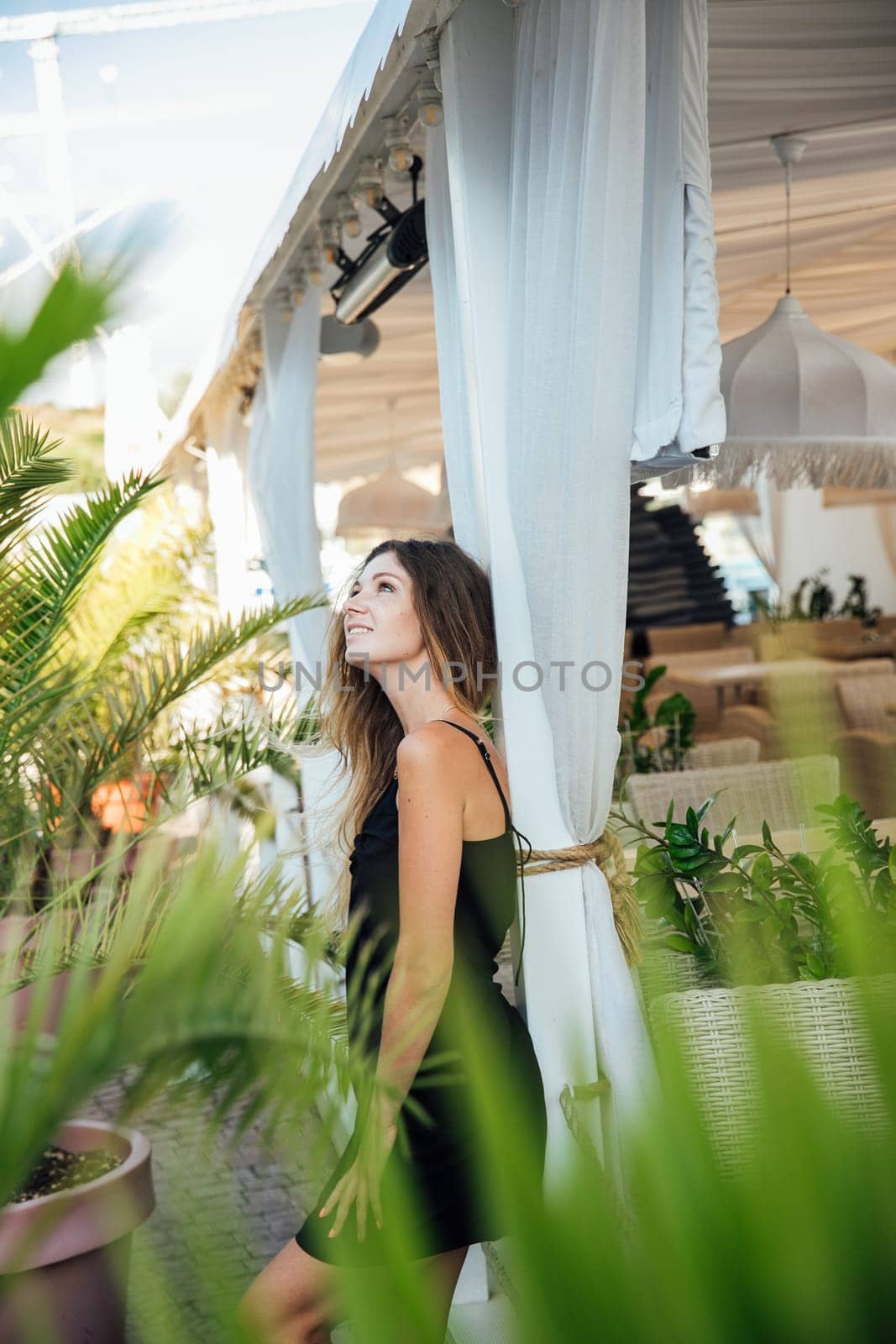 woman standing outside a restaurant on a walk travel vacation