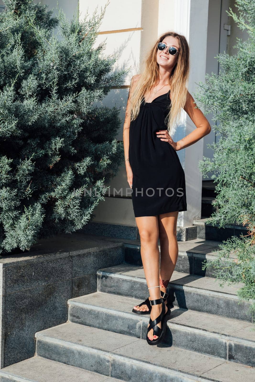 woman standing on the stairs on a walk travel vacation
