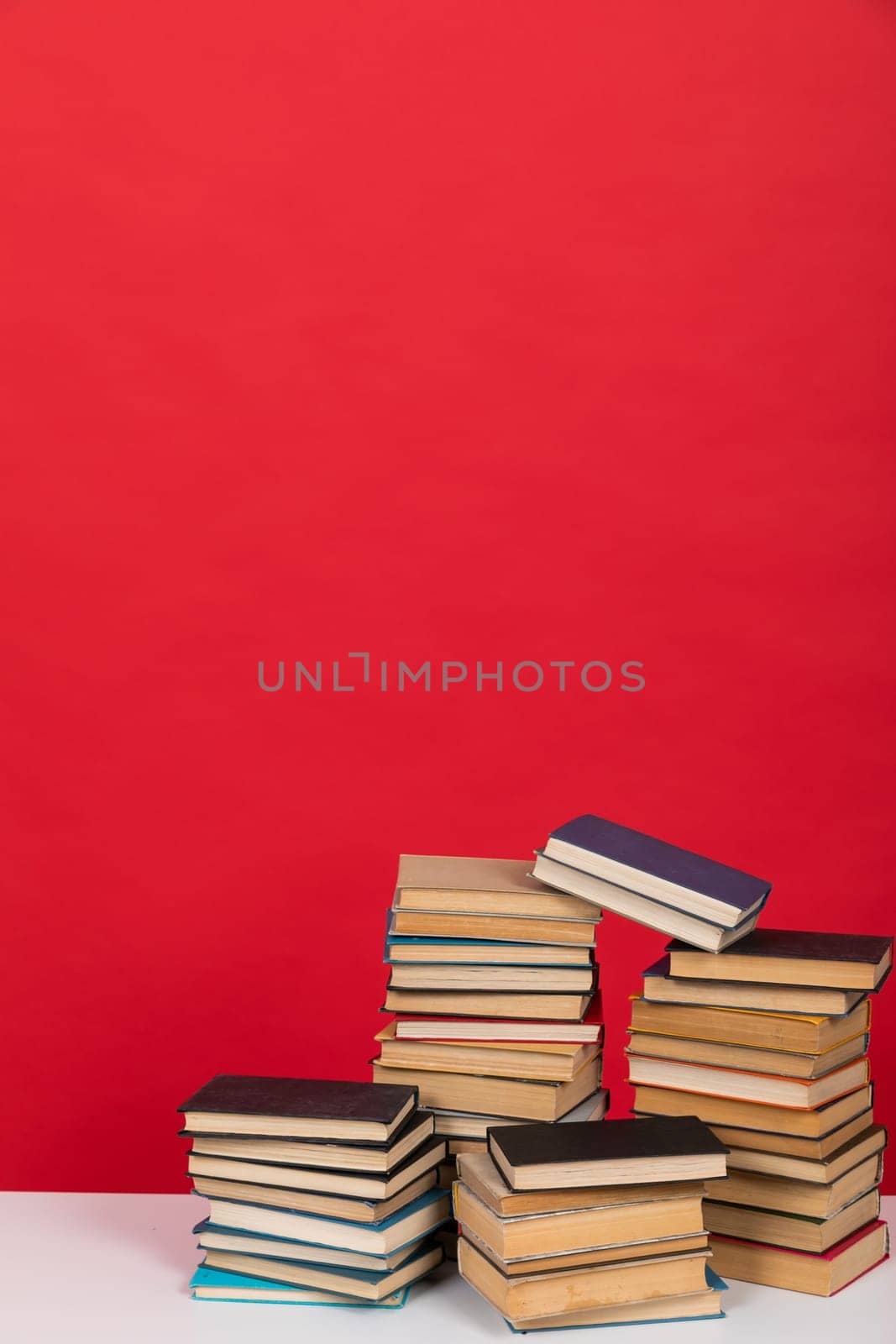 learning literacy science education stack of books on a green background by Simakov