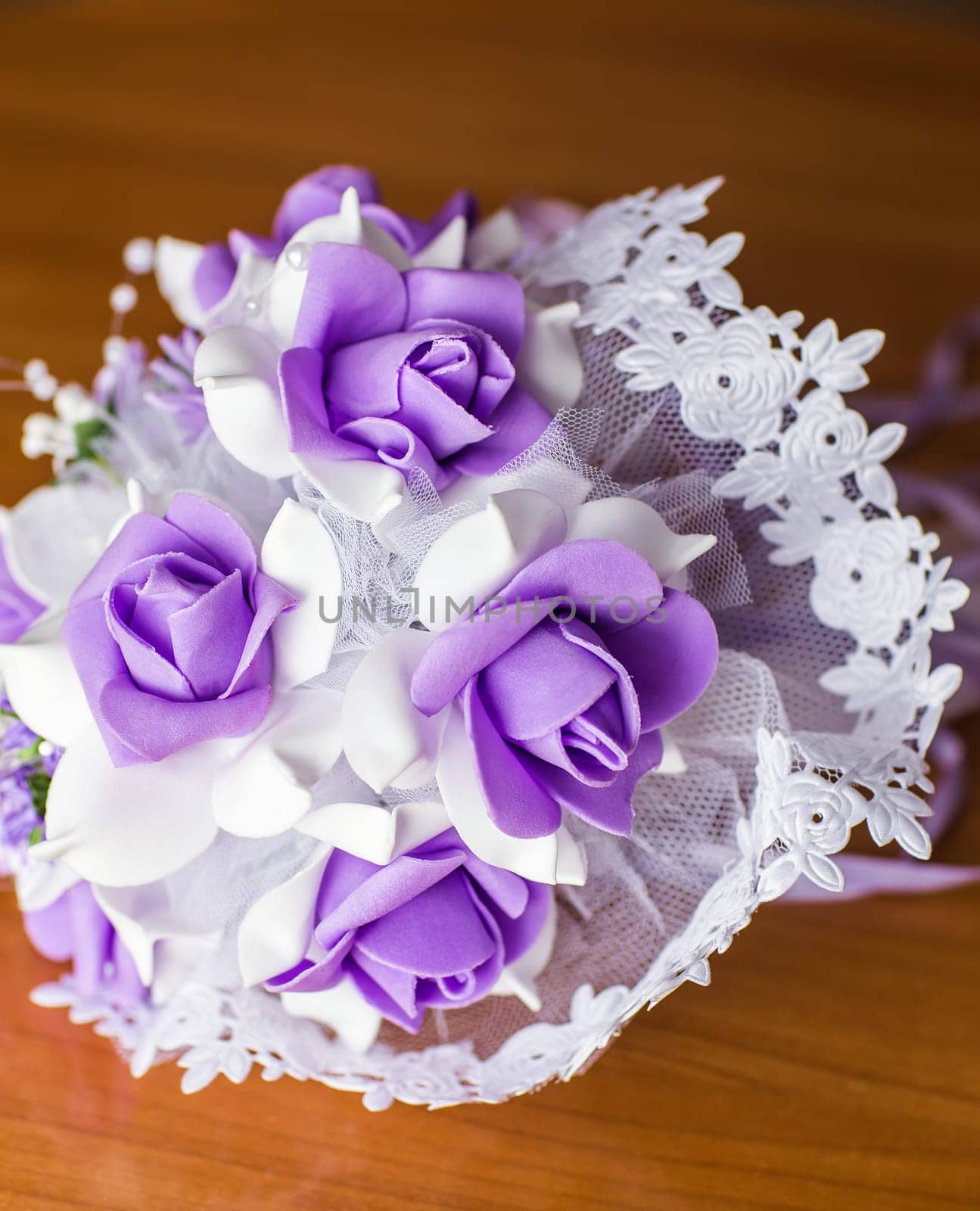 Beautiful purple artificial wedding bridal flowers bouquet.