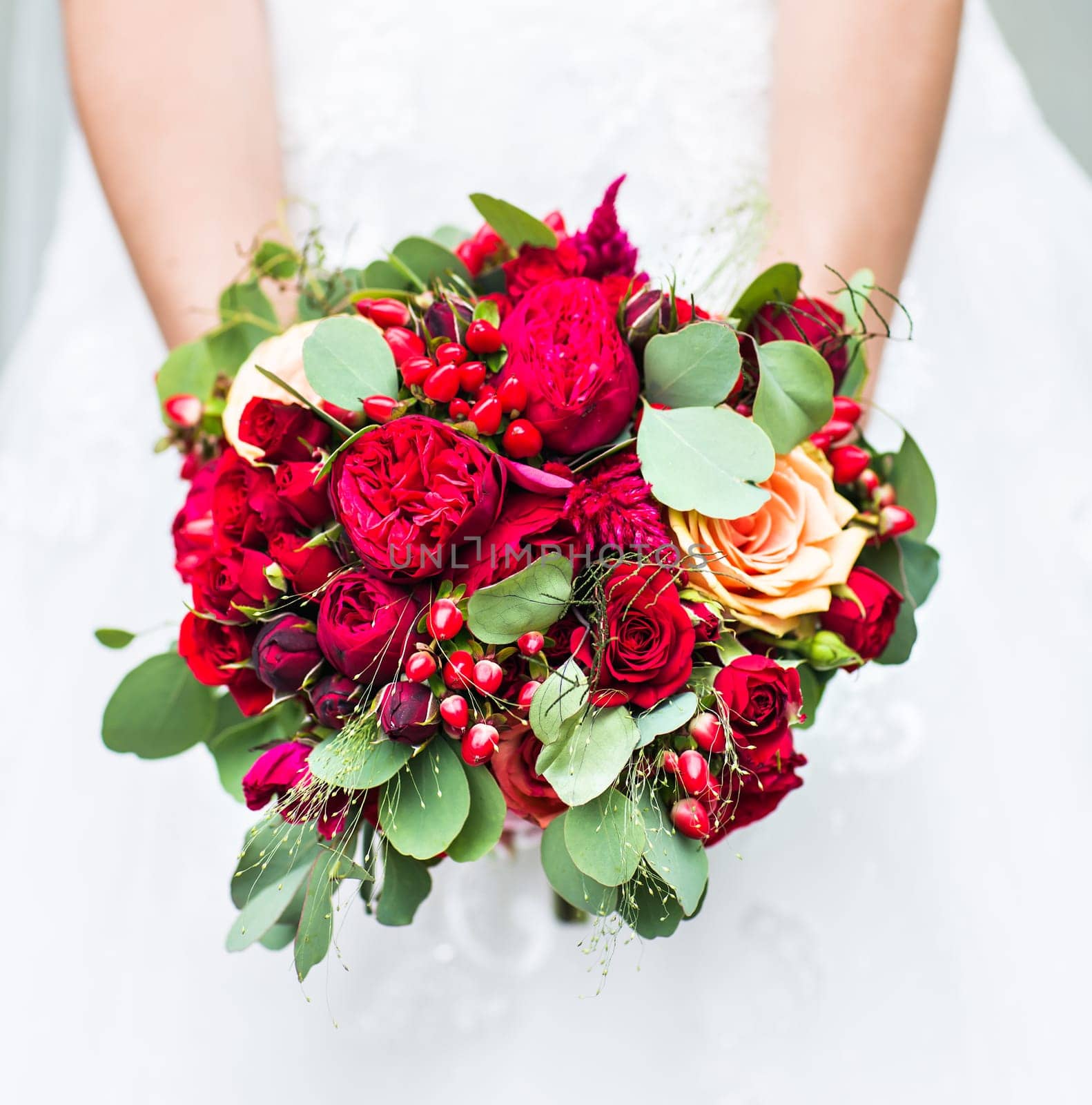 Beautiful wedding bouquet in hands of the bride close-up by Satura86