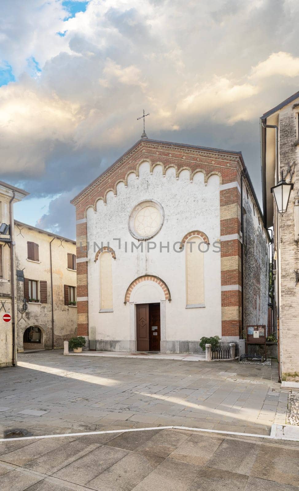 Portobuffolè, Italy. November 9, 2023. facade of the medieval church in the city center