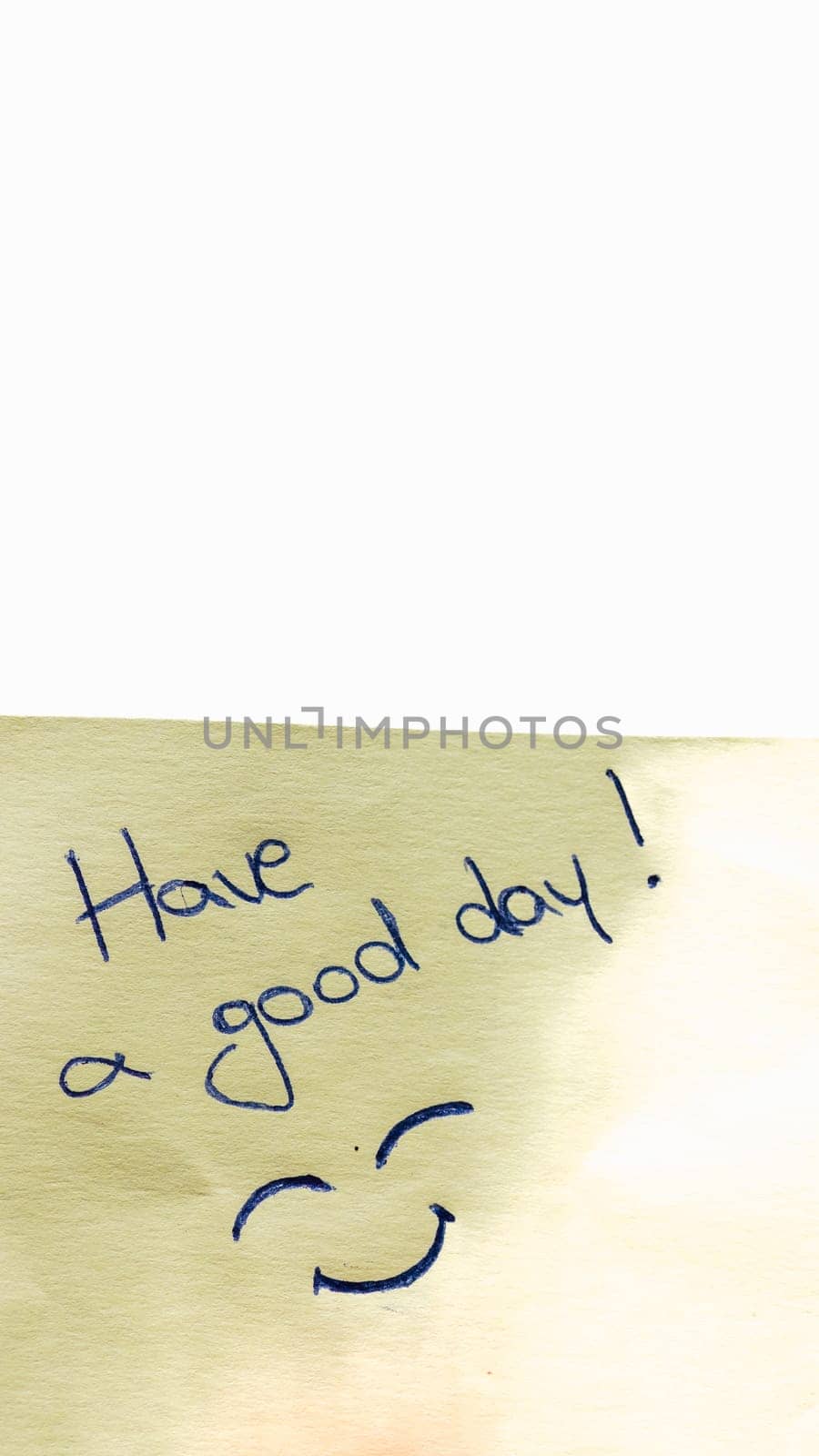 Have a good day handwriting text close up isolated on yellow paper with copy space. by vladispas