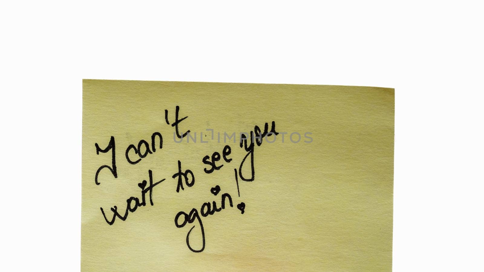 I can not wait to see you again handwriting text close up isolated on yellow paper with copy space.