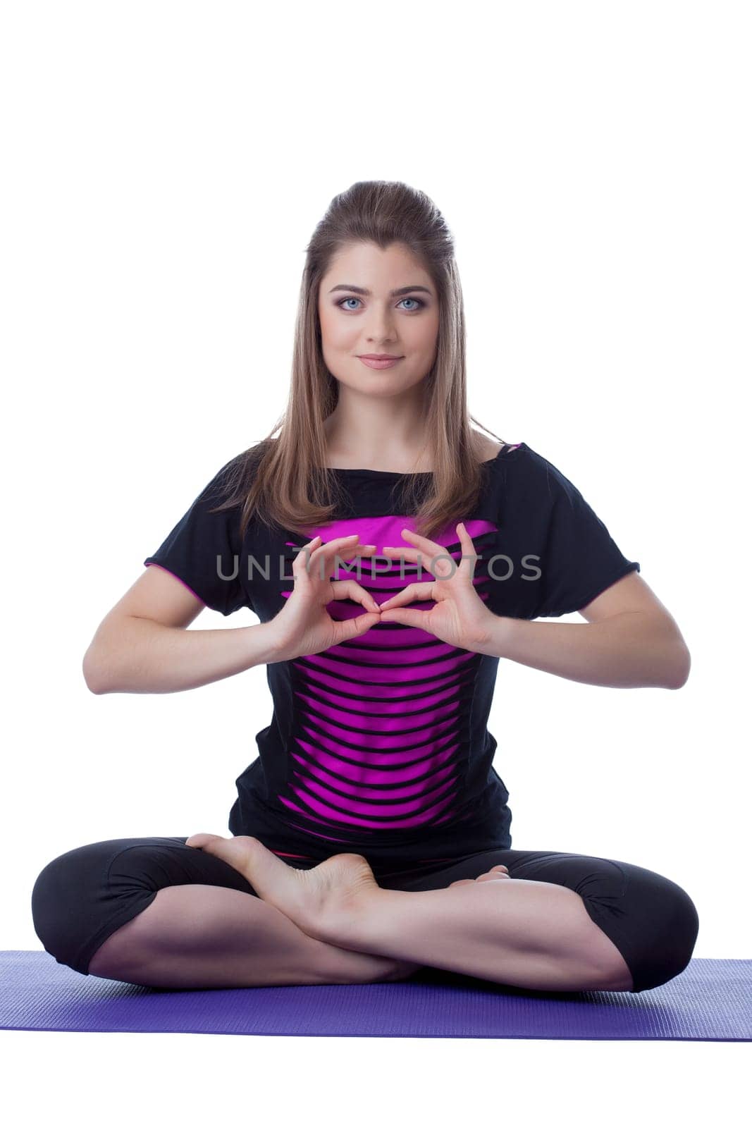 Charming woman posing in lotus position by rivertime