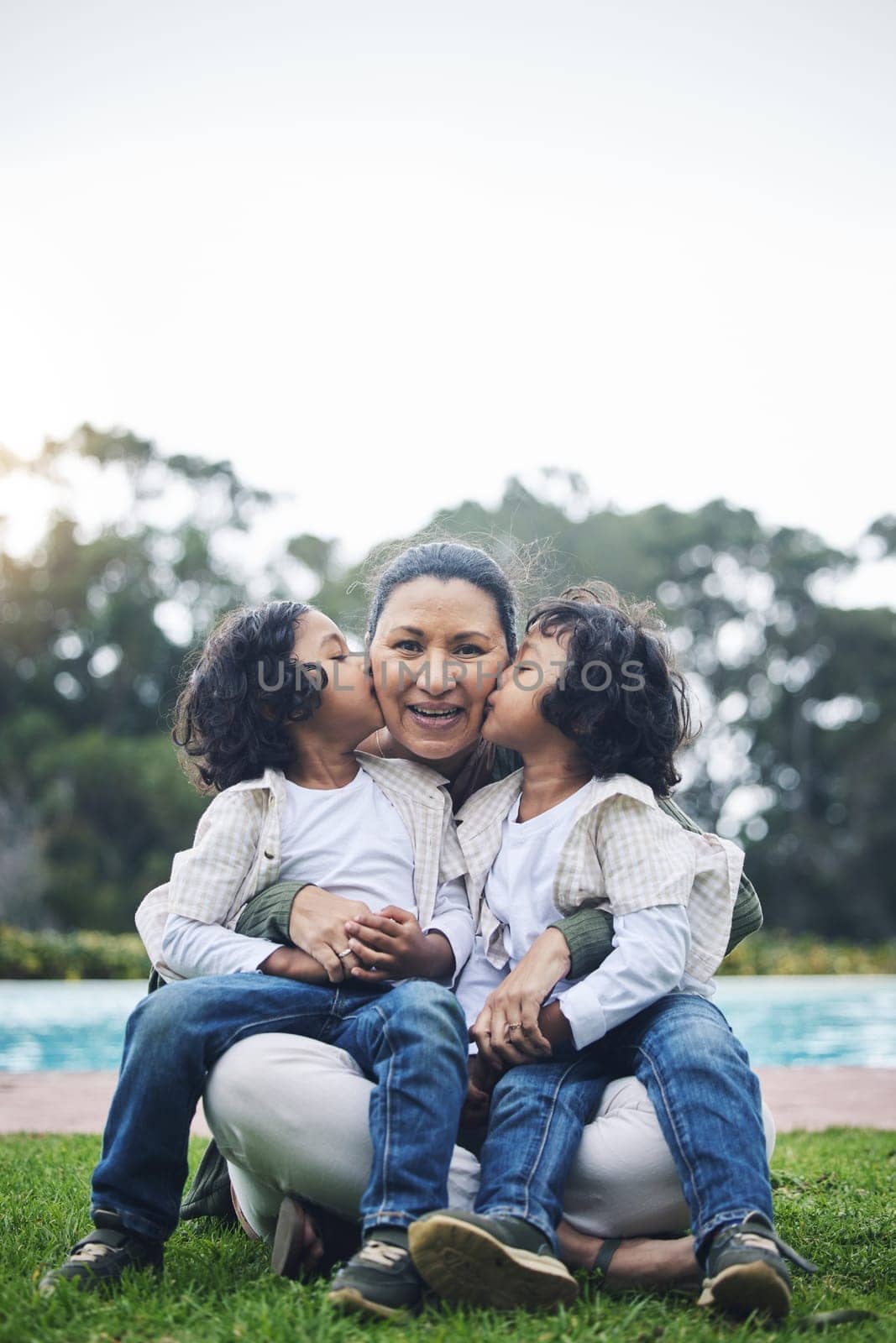 Park, kiss and portrait of mother and children for bonding, quality time and affection outdoors together. Happy family, relax and kids with mom in nature embrace for care, loving relationship and joy.