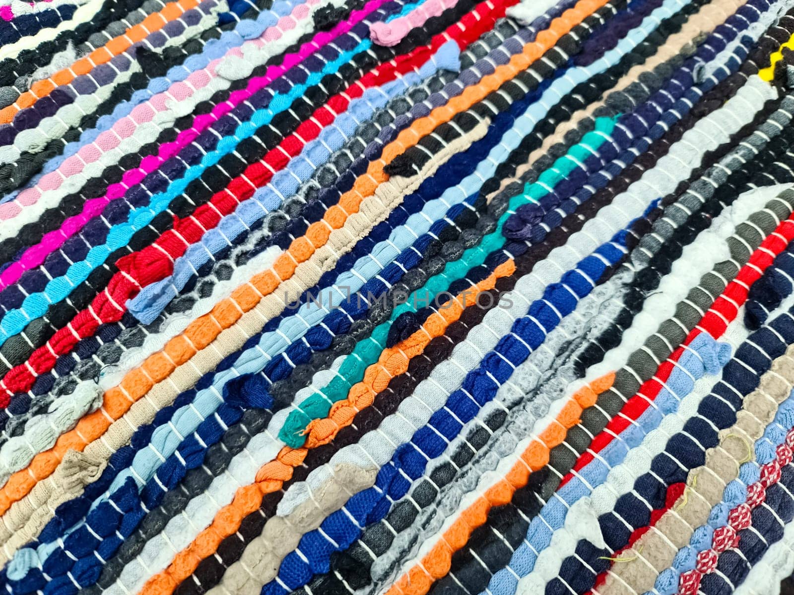 Samples of cloth and fabrics in different colors found at a fabrics market.