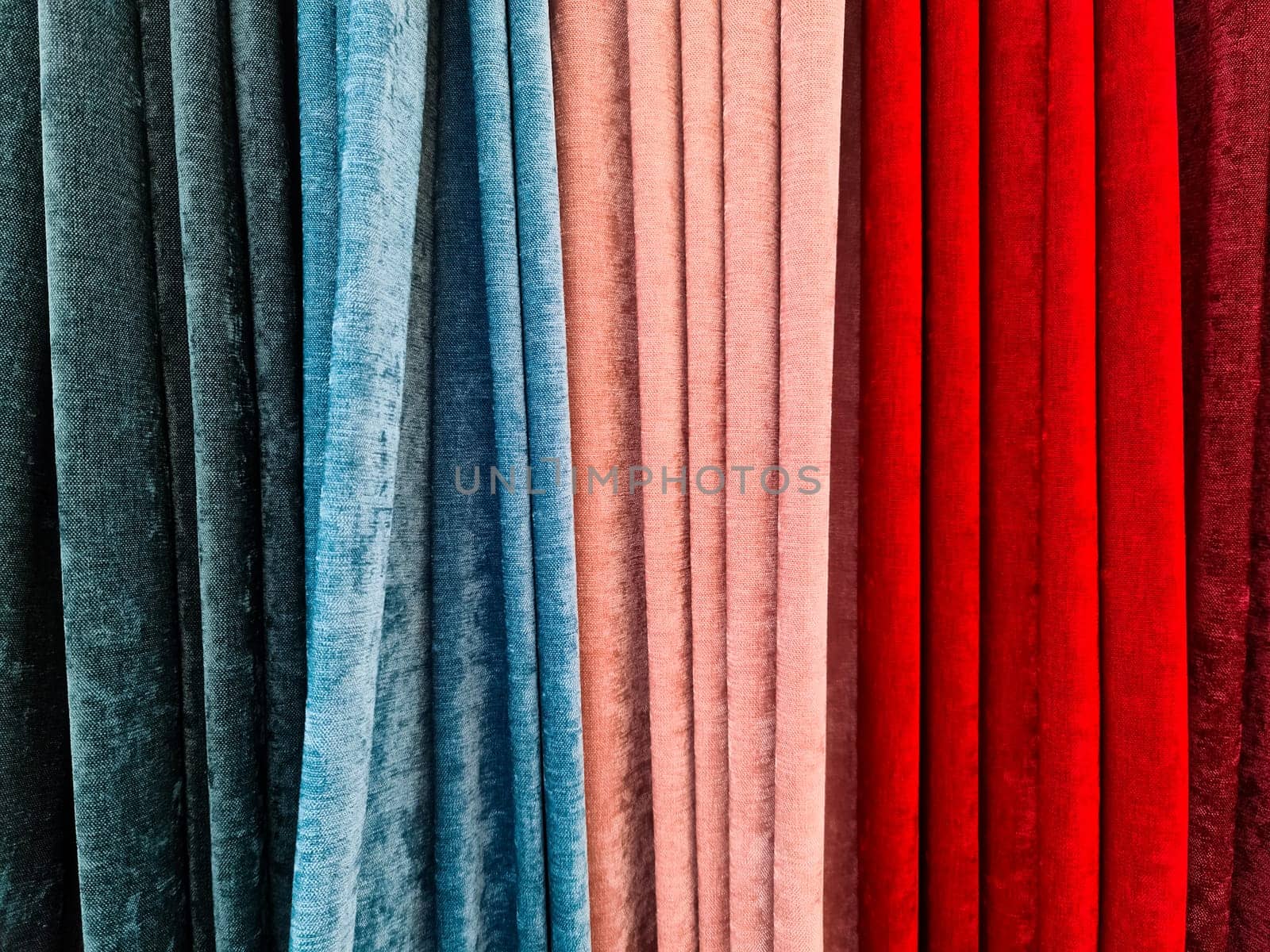 Samples of cloth and fabrics in different colors at a fabrics market by MP_foto71