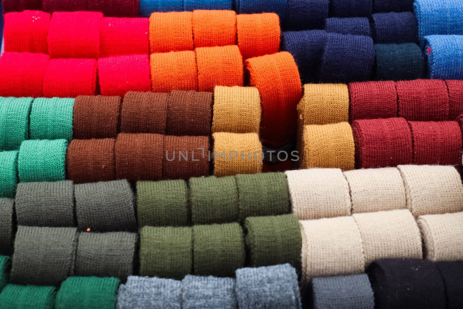 Samples of cloth and fabrics in different colors at a fabrics market by MP_foto71